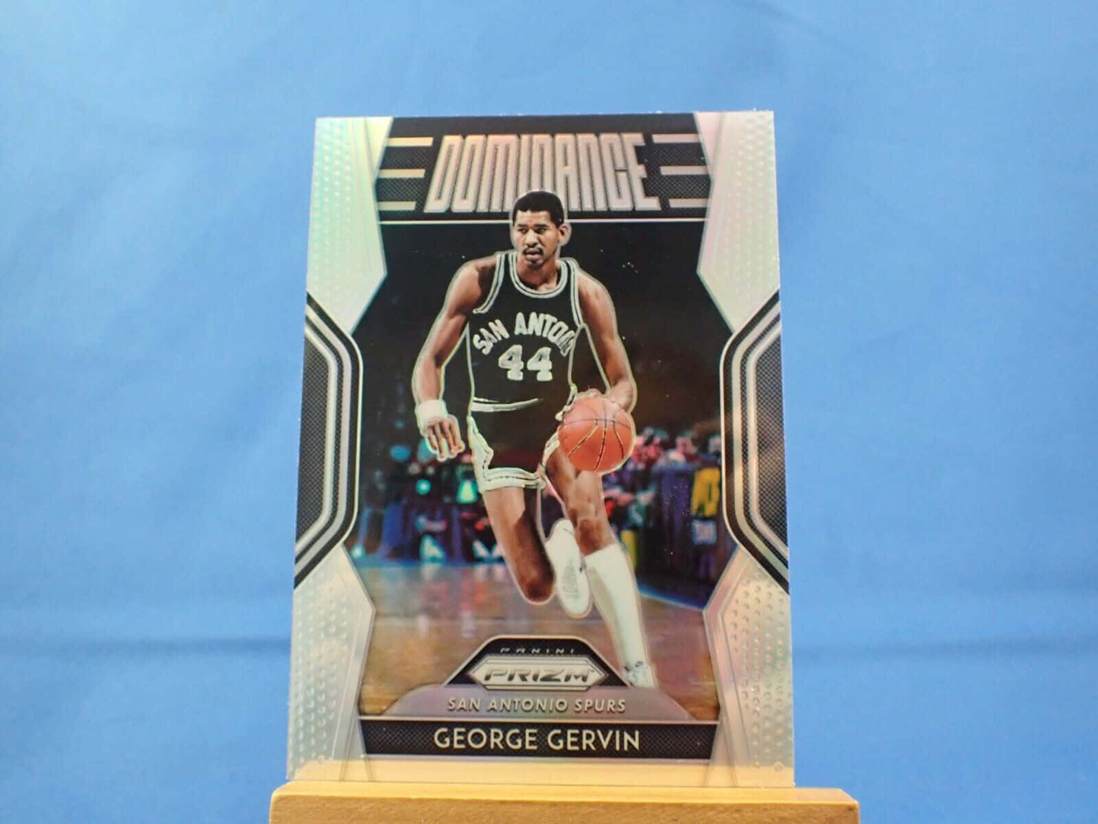 Iconic Collectible Card Of Basketball Legend George Gervin Background