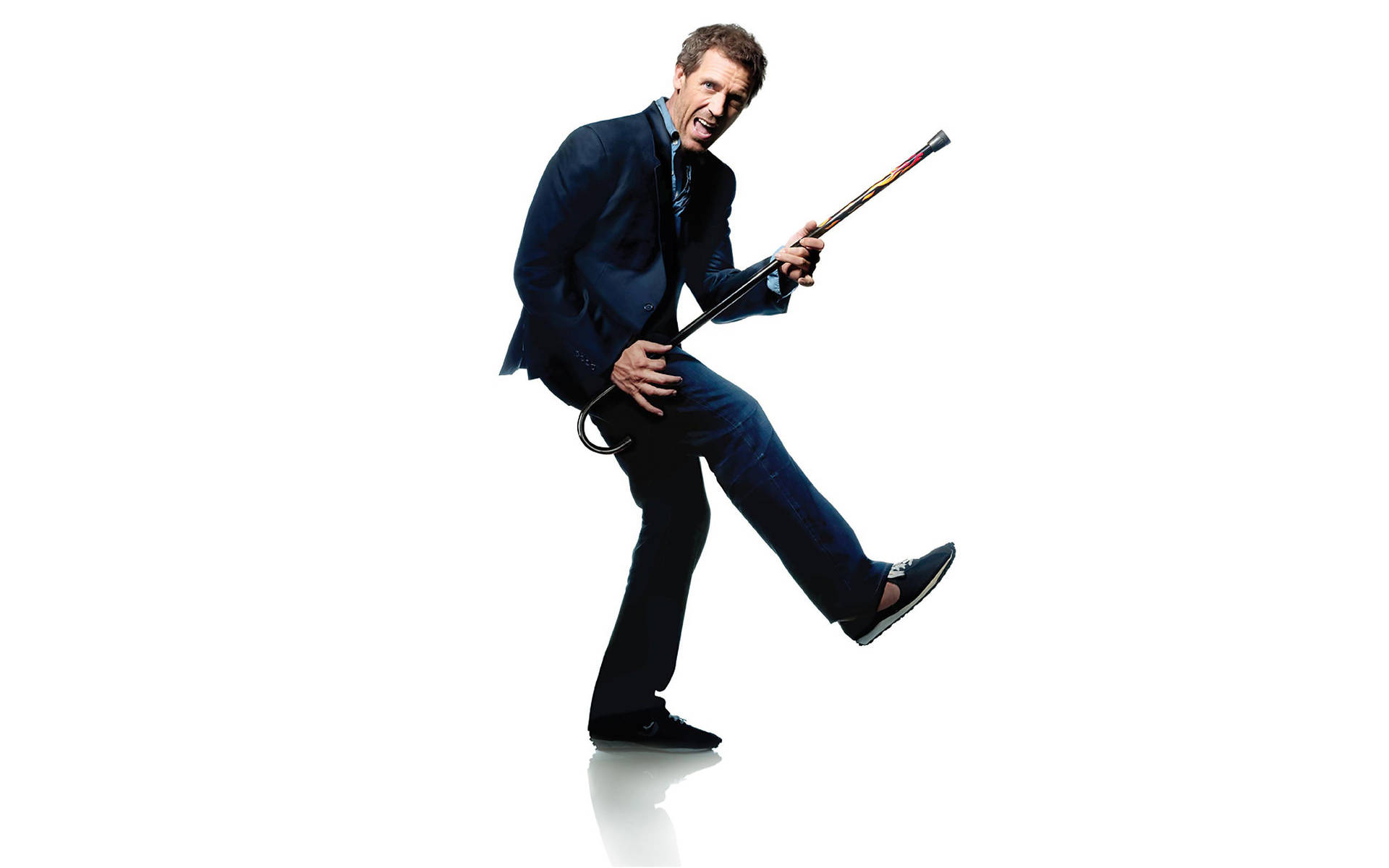 Iconic Dr. House With His Signature Cane And Guitar Background