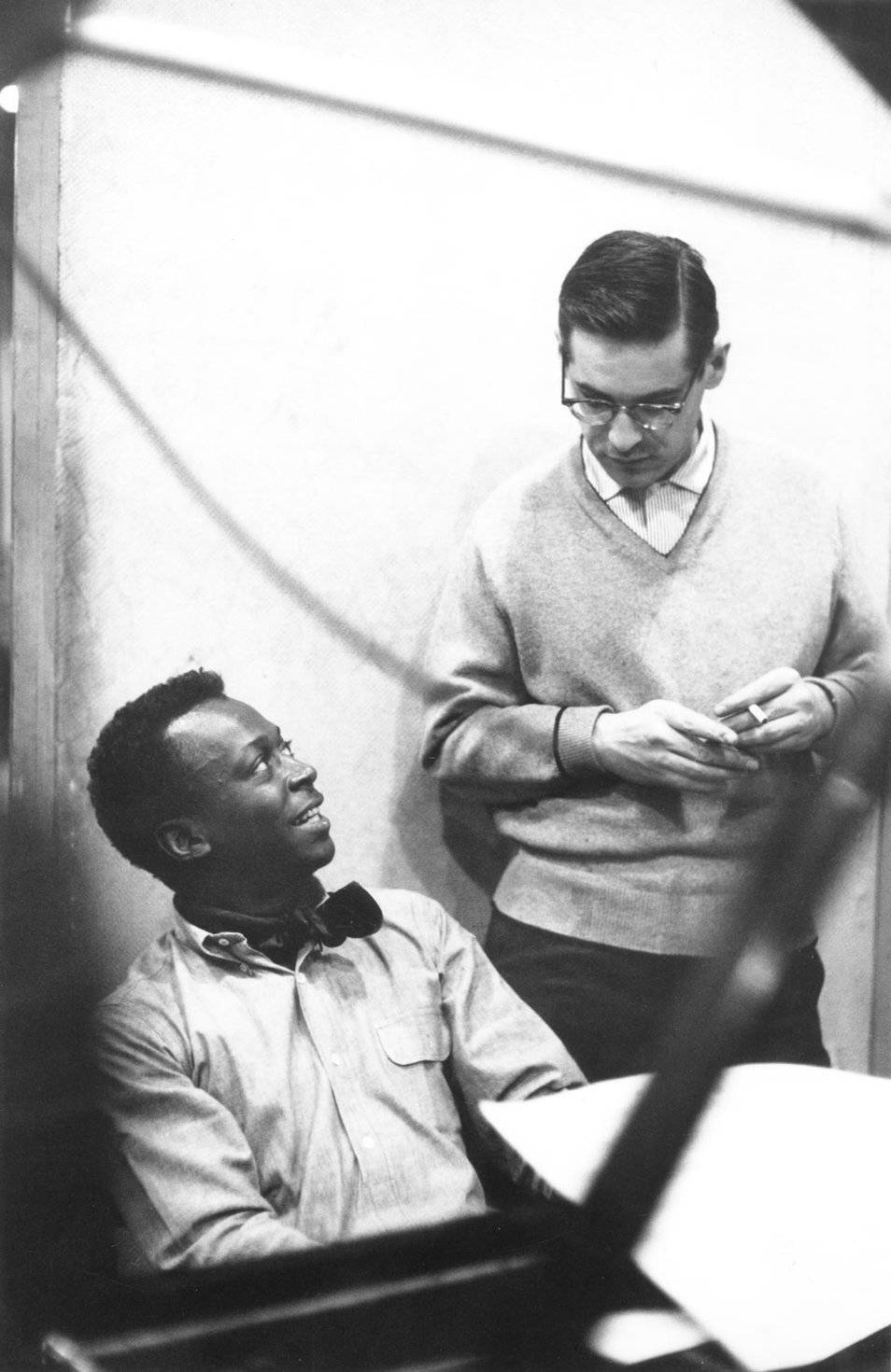 Iconic Duo - Miles Davis And Bill Evans In An Intimate Musical Moment Background