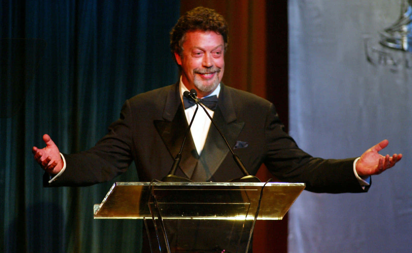 Iconic English Actor Tim Curry Captured In A Timeless Portrait Background