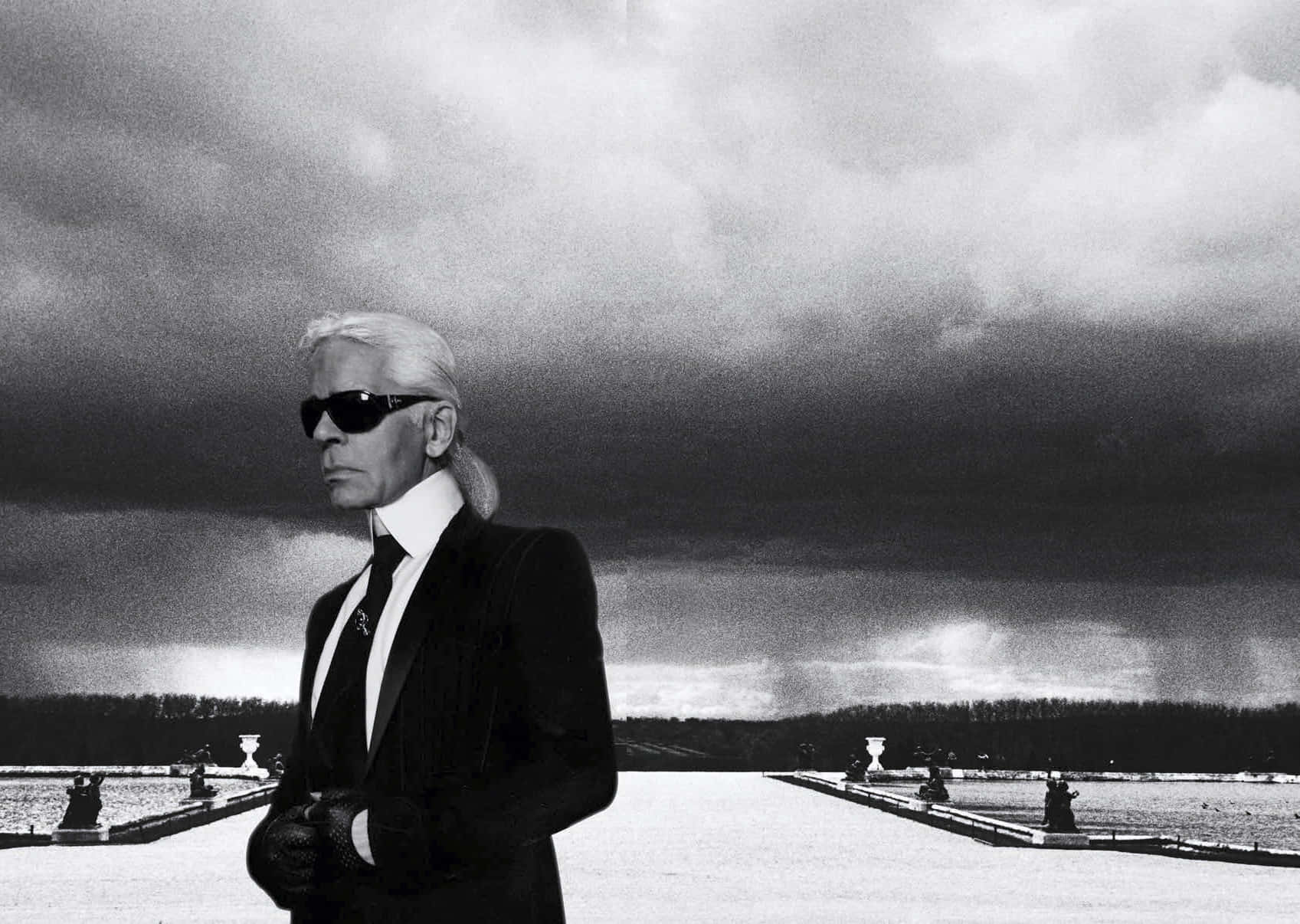“iconic Fashion Designer Karl Lagerfeld Seen In A Classic Leather Jacket And Glasses.” Background