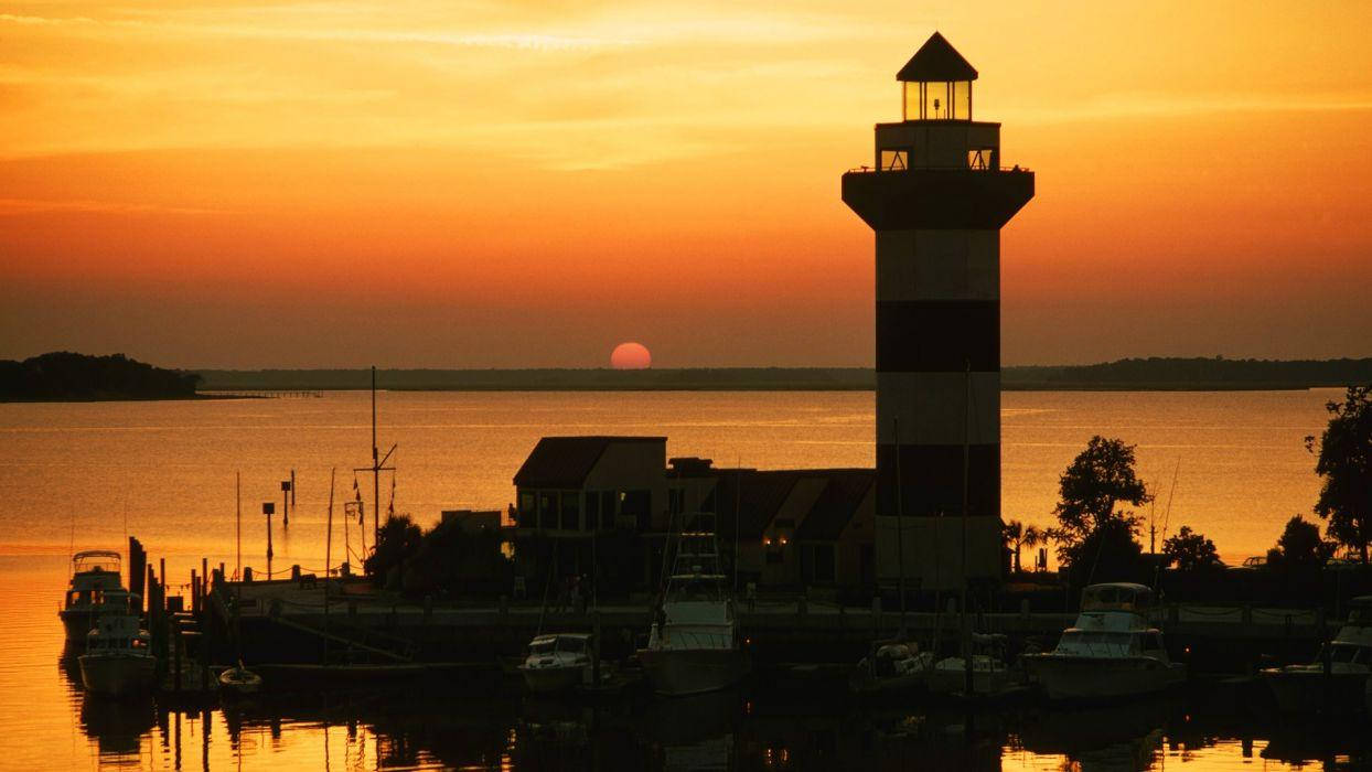 Iconic Harbour Town Lighthouse Silhouette At Dusk, South Carolina Background