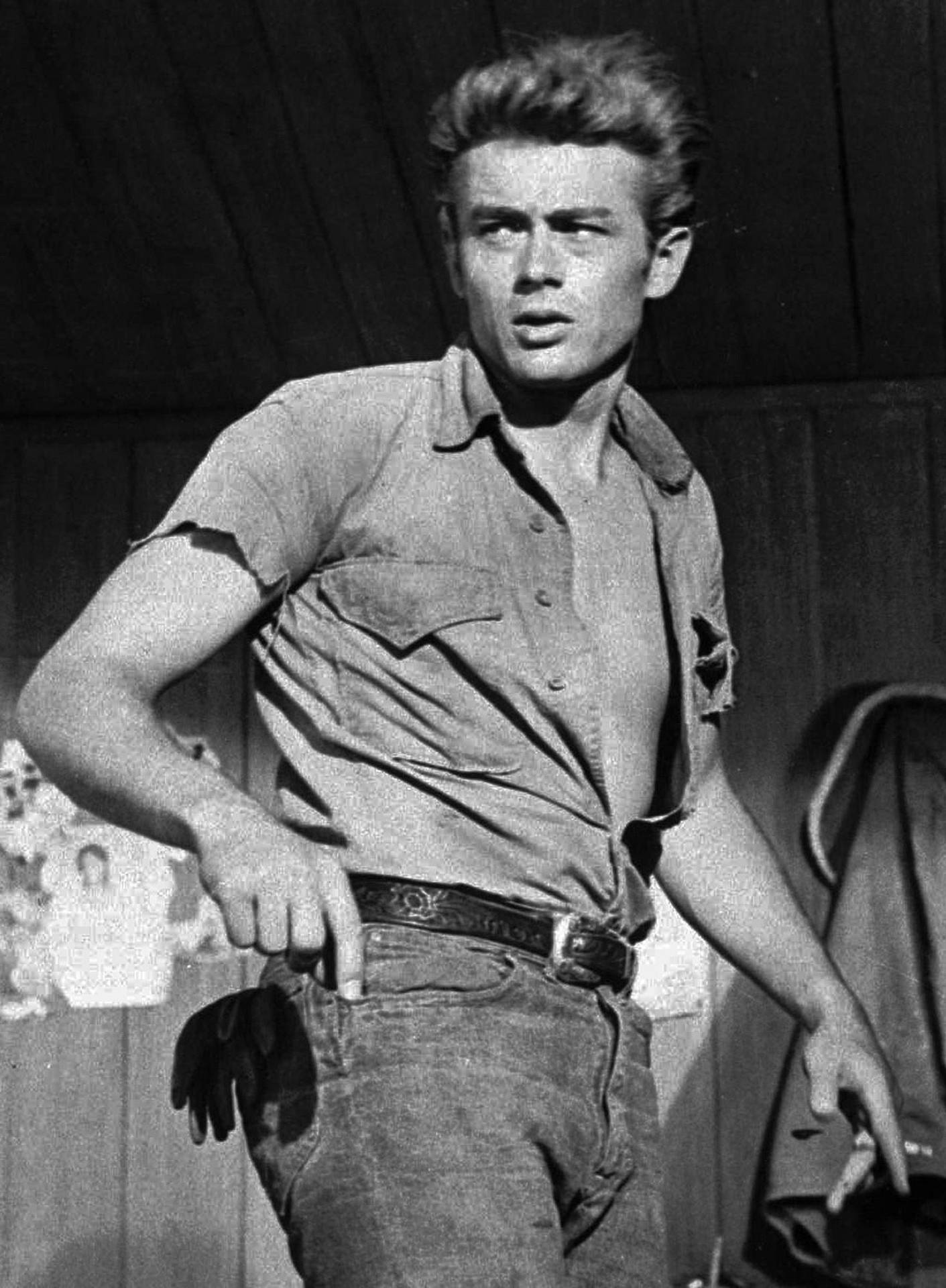 Iconic James Dean Smirking In Open Shirt Background