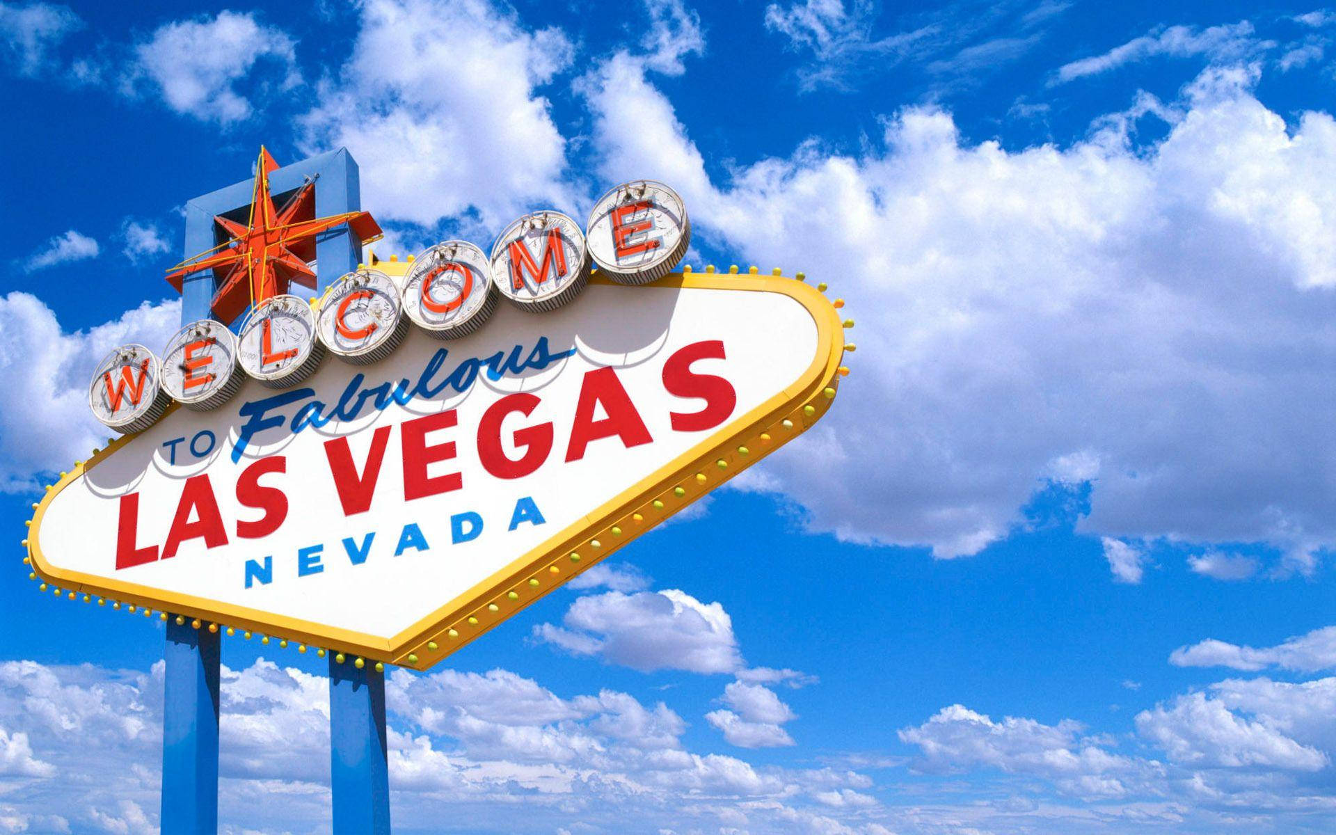 Iconic Las Vegas Strip Sign Against A Cloudy Sky Background