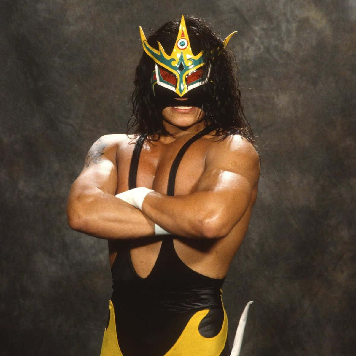Iconic Luchador Juventud Guerrera Showcasing His Signature Mask Background