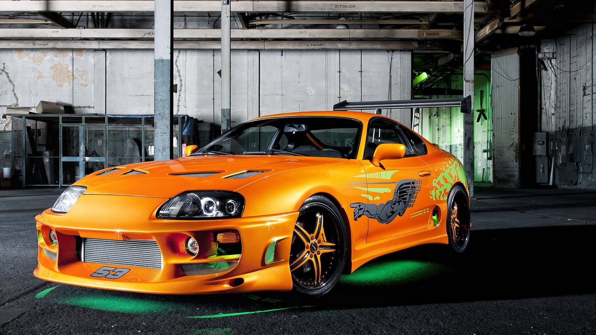 Iconic Metallic Orange Toyota Supra Background