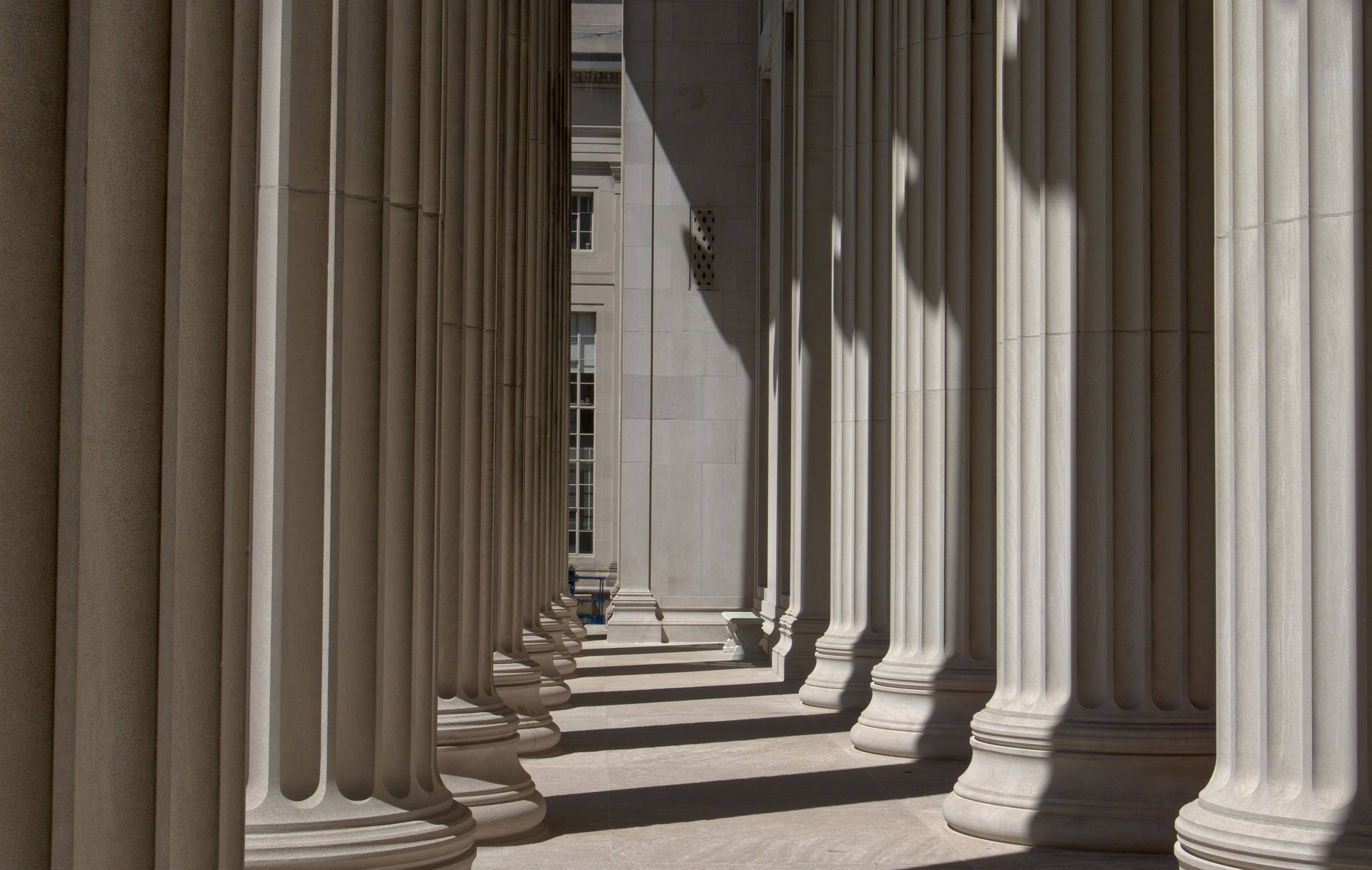 Iconic Mit Building With Historical Pillars Background