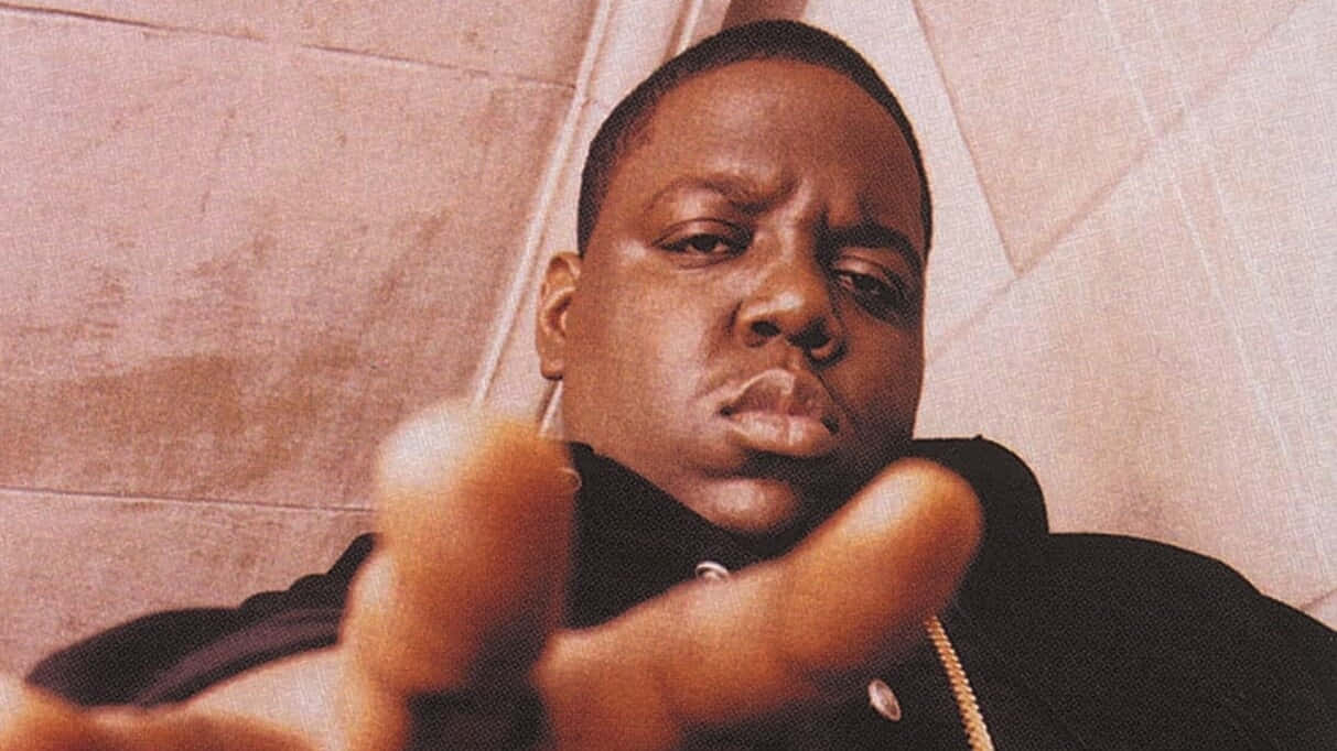 Iconic Rapper Pointingat Camera Background