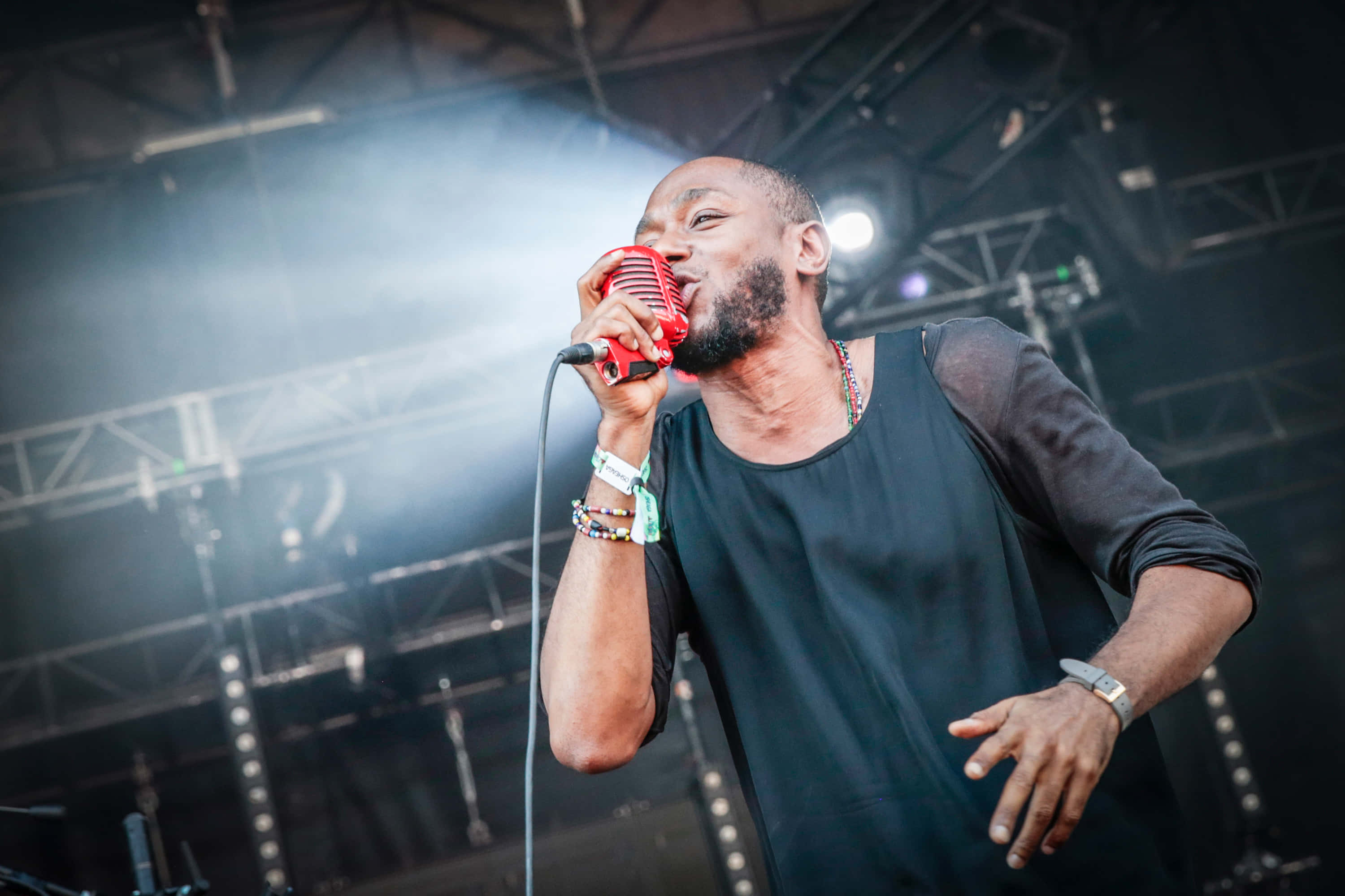 Iconic Rapper Yasiin Bey In Subdued Light Background