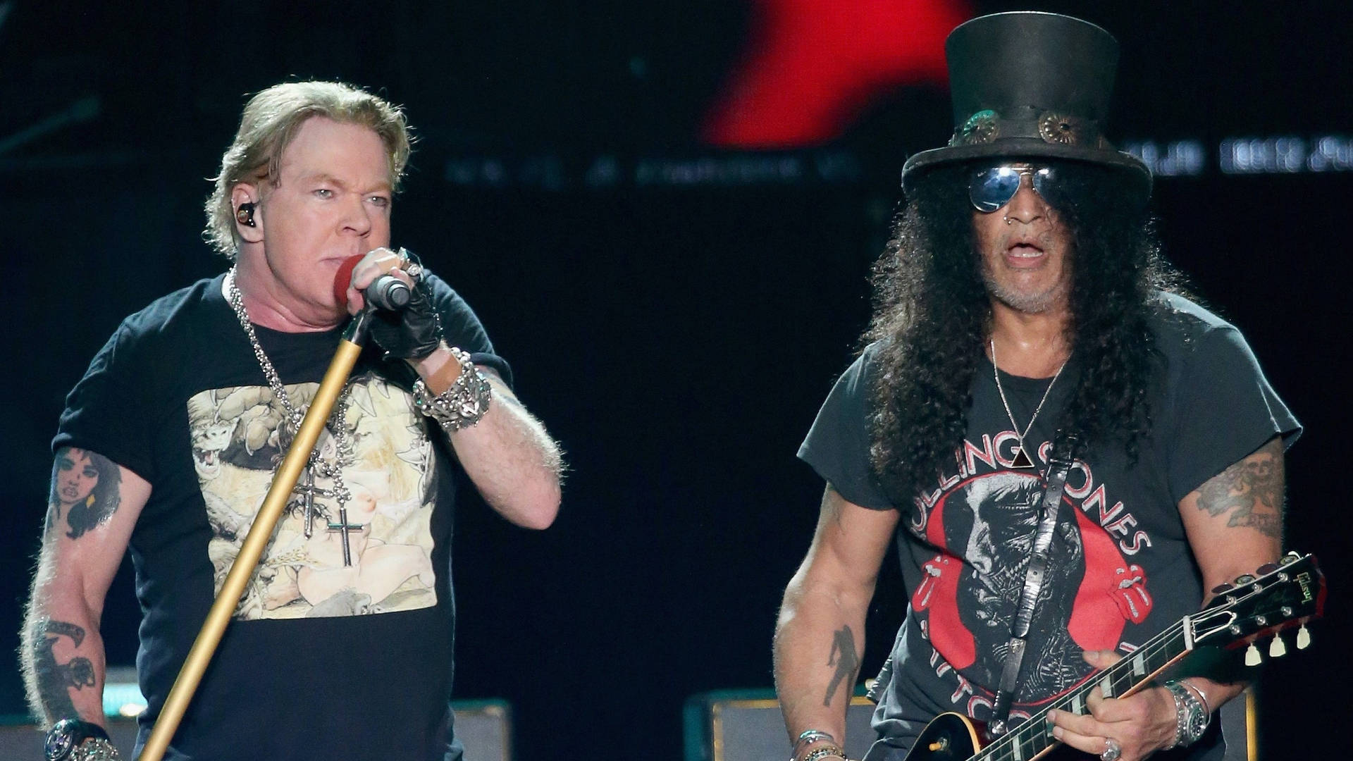 Iconic Rock Band Guns N' Roses Live On Stage Background