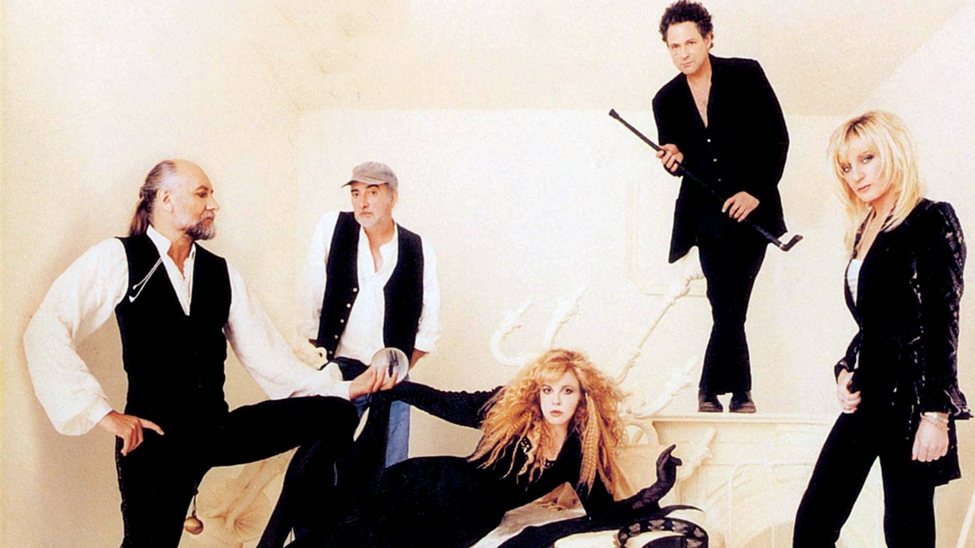 Iconic Shot Of Fleetwood Mac In Monochrome Attire Background