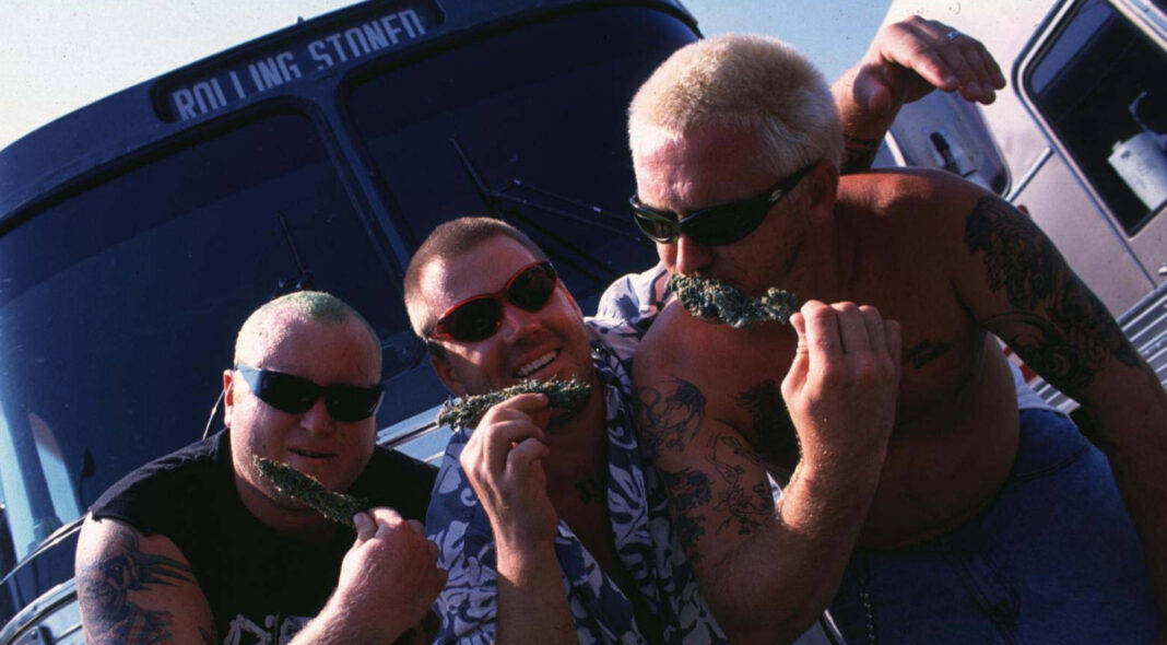 Iconic Sublime Band Poses In Front Of A Graffiti Bus Background