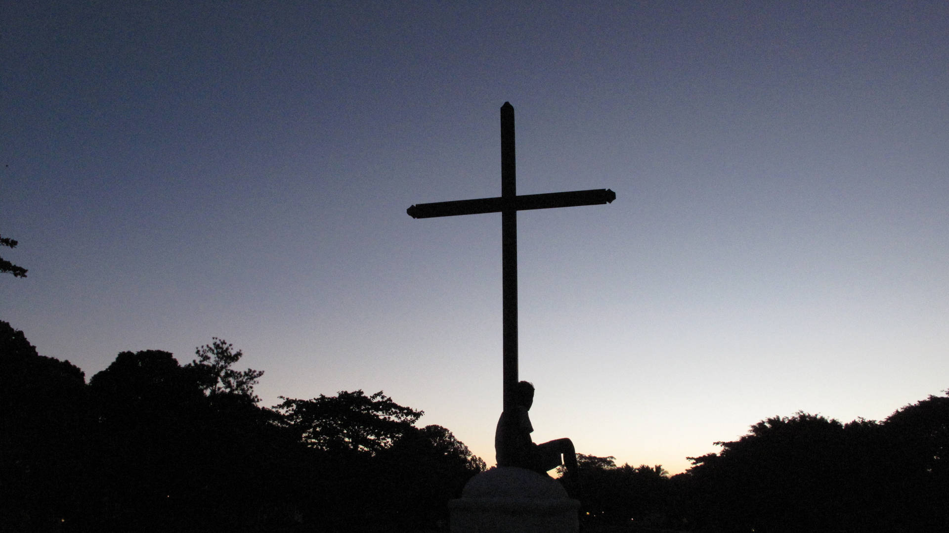 Iconic Symbol Of Faith – A Wooden Cross Background