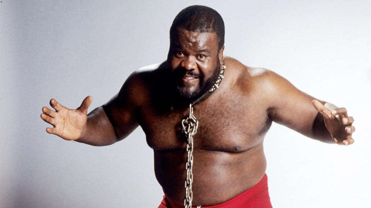 Iconic Wrestler With Chain Background