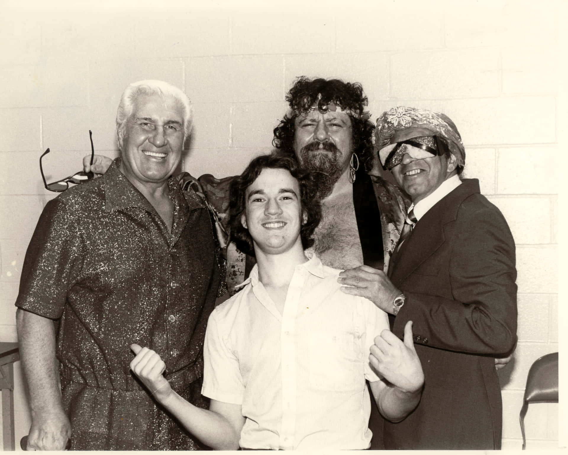 Iconic Wrestling Manager, Captain Lou Albano, In A Candid Shot With Fellow Management Professionals. Background