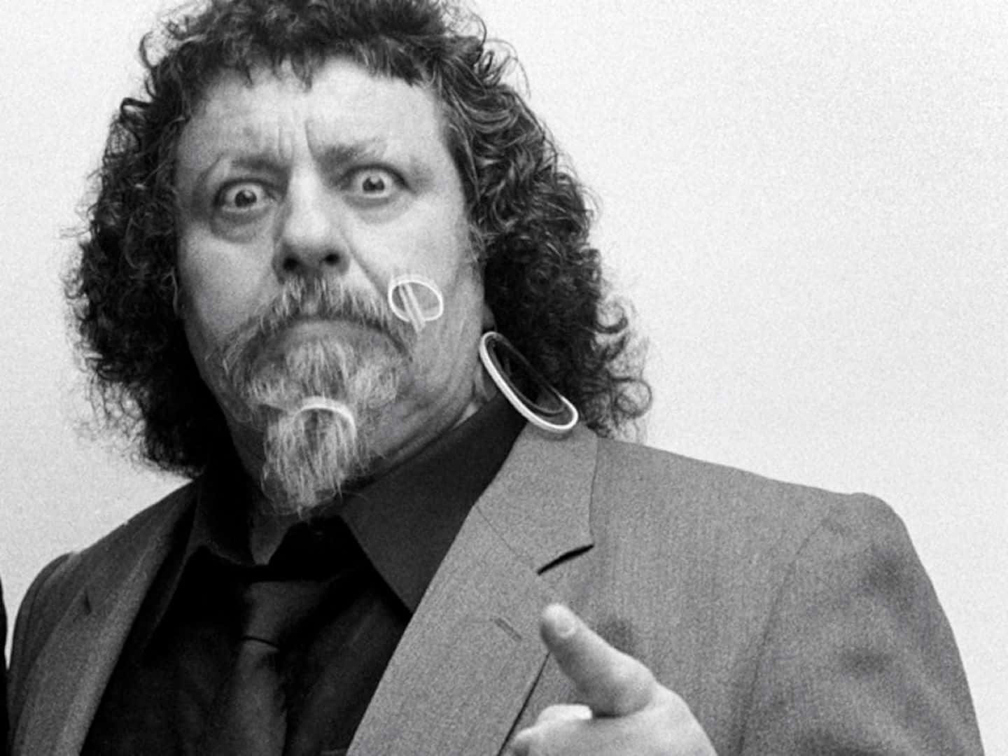 Iconic Wrestling Personality Pointing Background