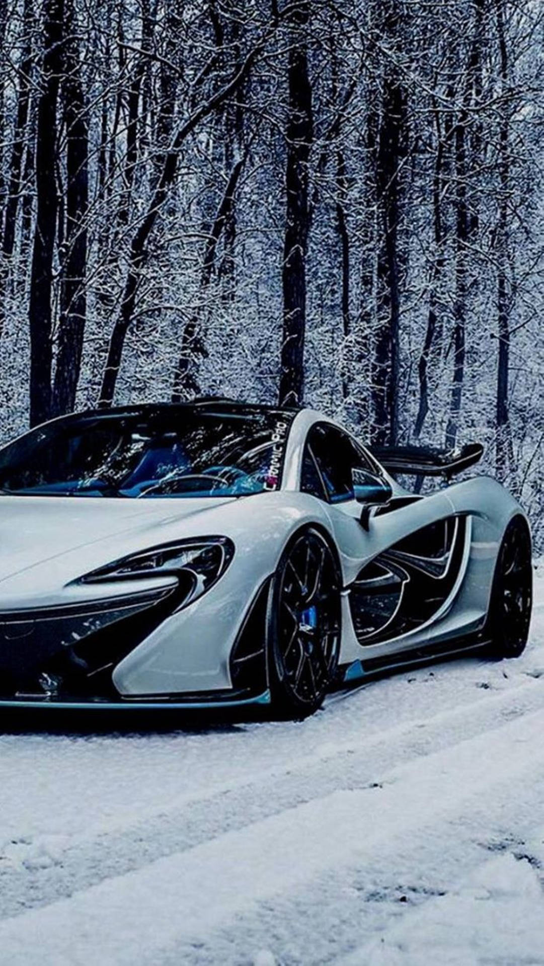 Icy Elegance: Mclaren P1 In A Snowy Landscape Viewed From An Iphone Background