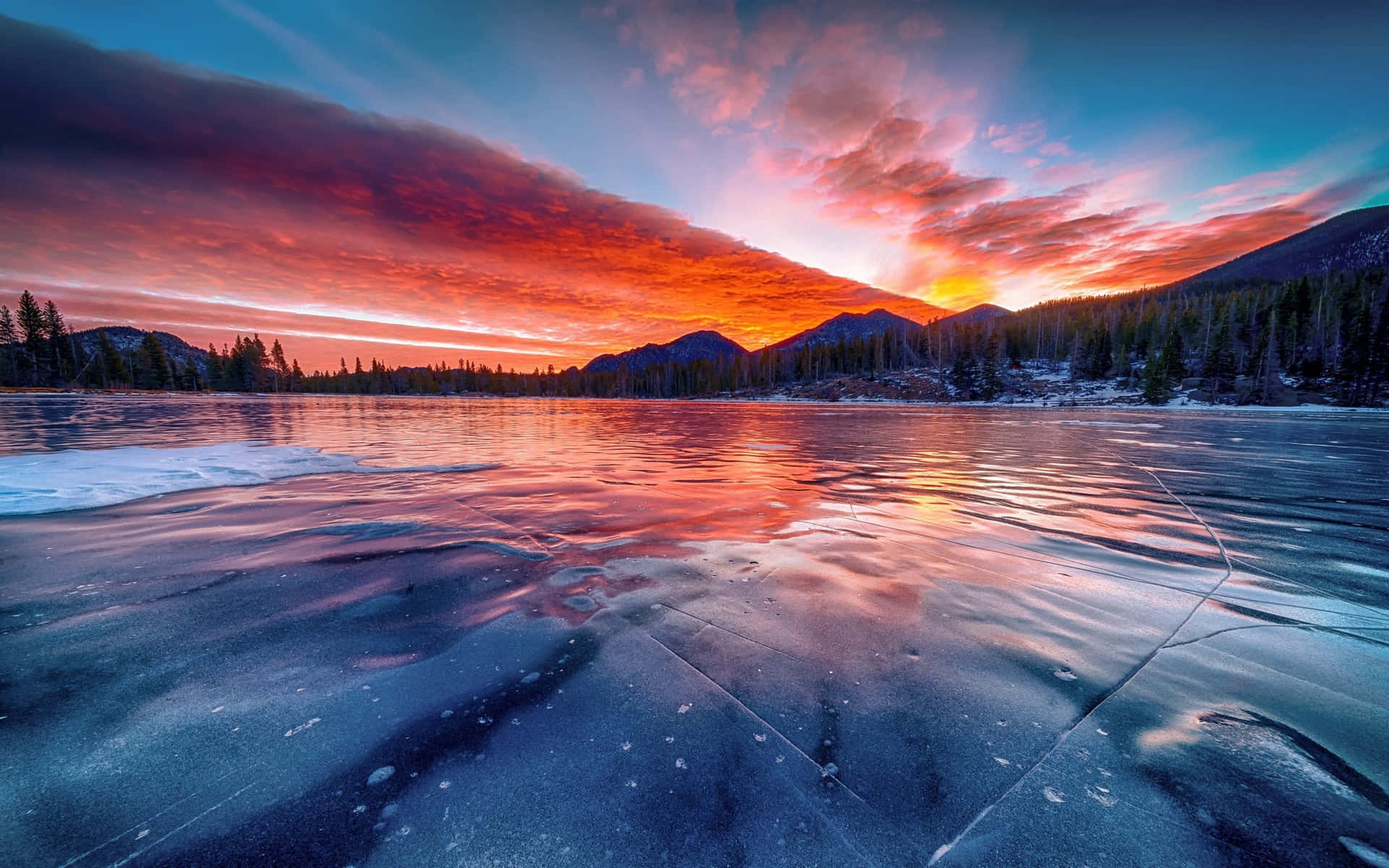 Icy Lake With Mountains Sunset