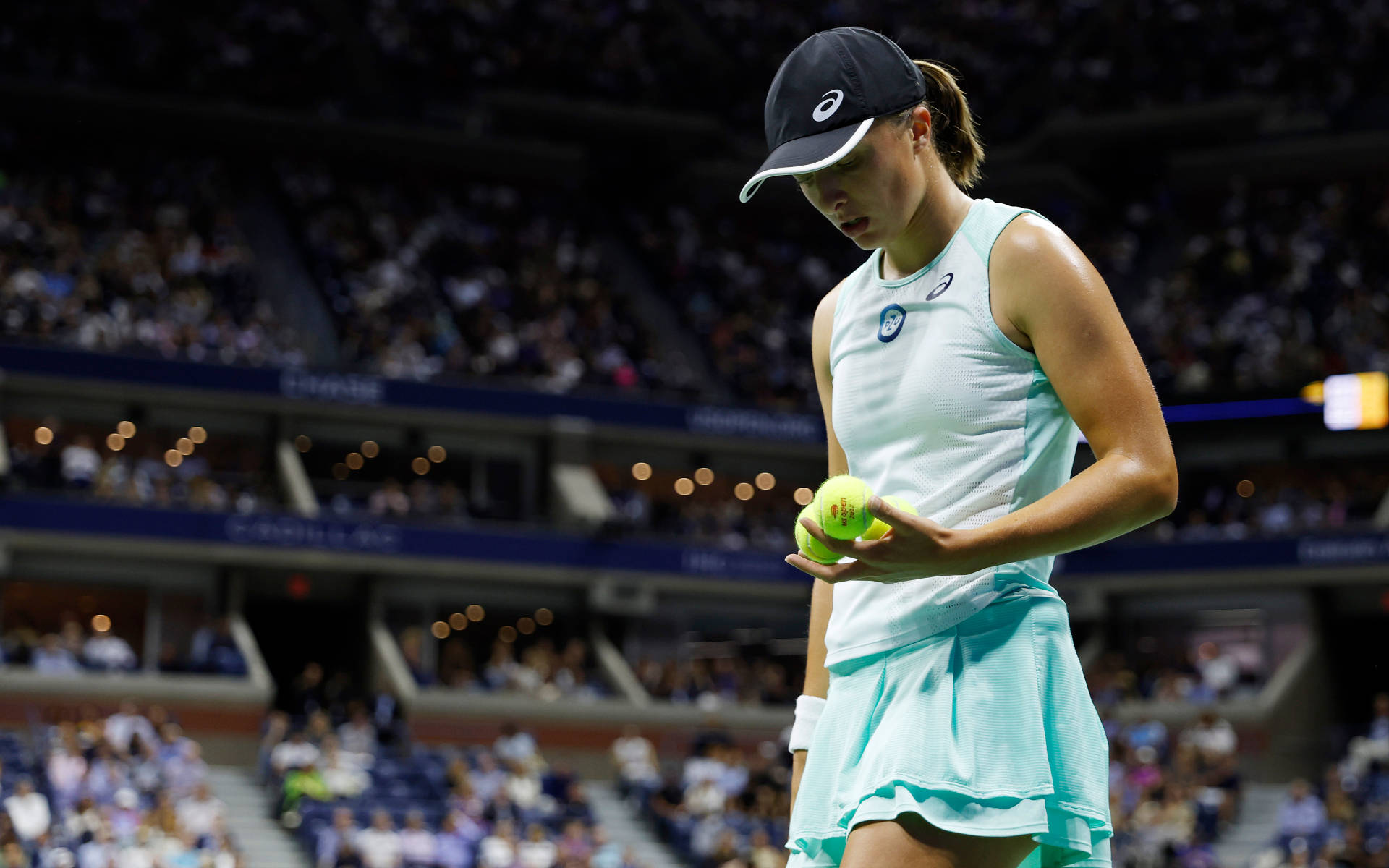 Iga Swiatek Holding Three Tennis Balls