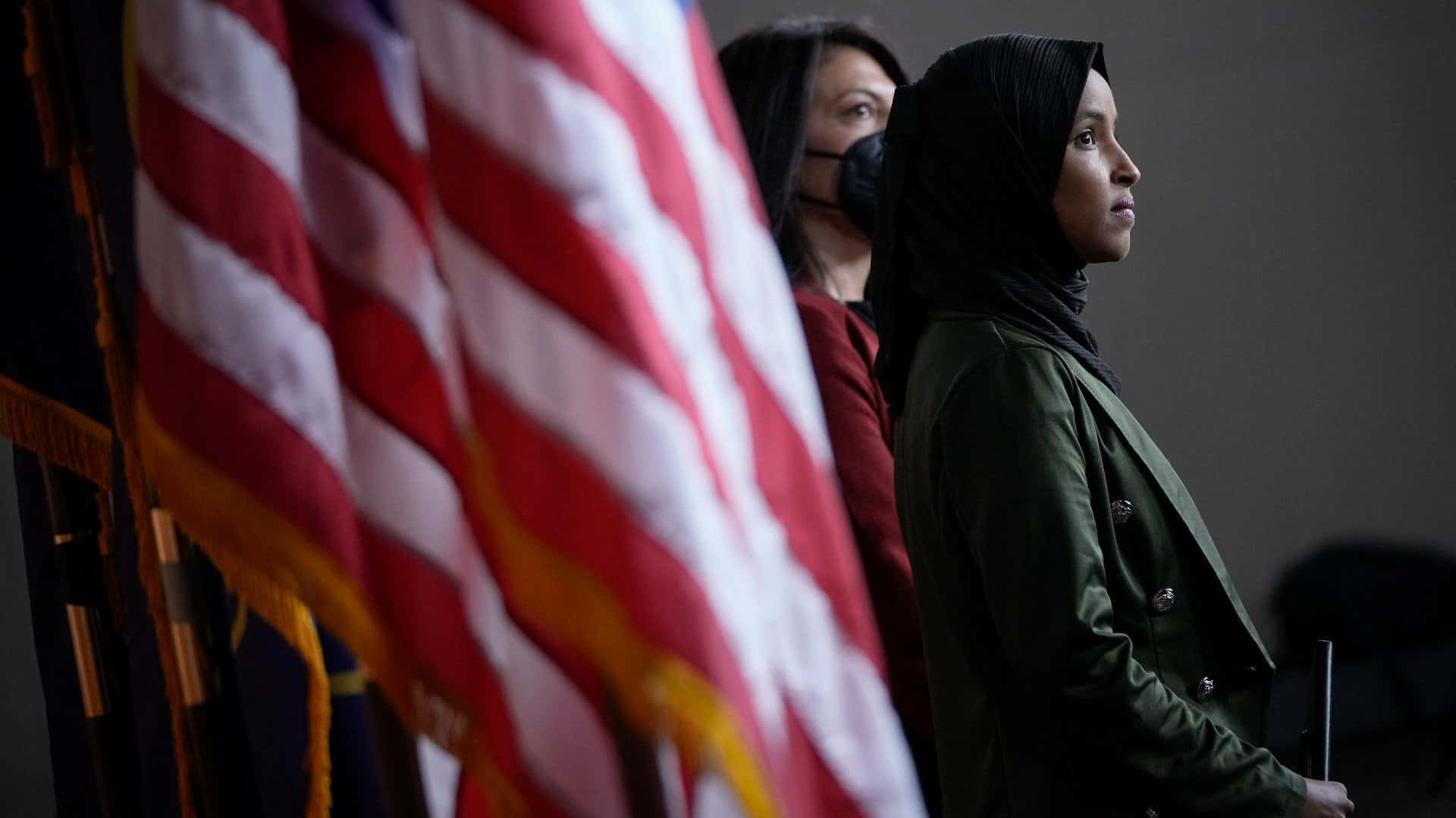 Ilhan Omar Beside The Us Flag Background
