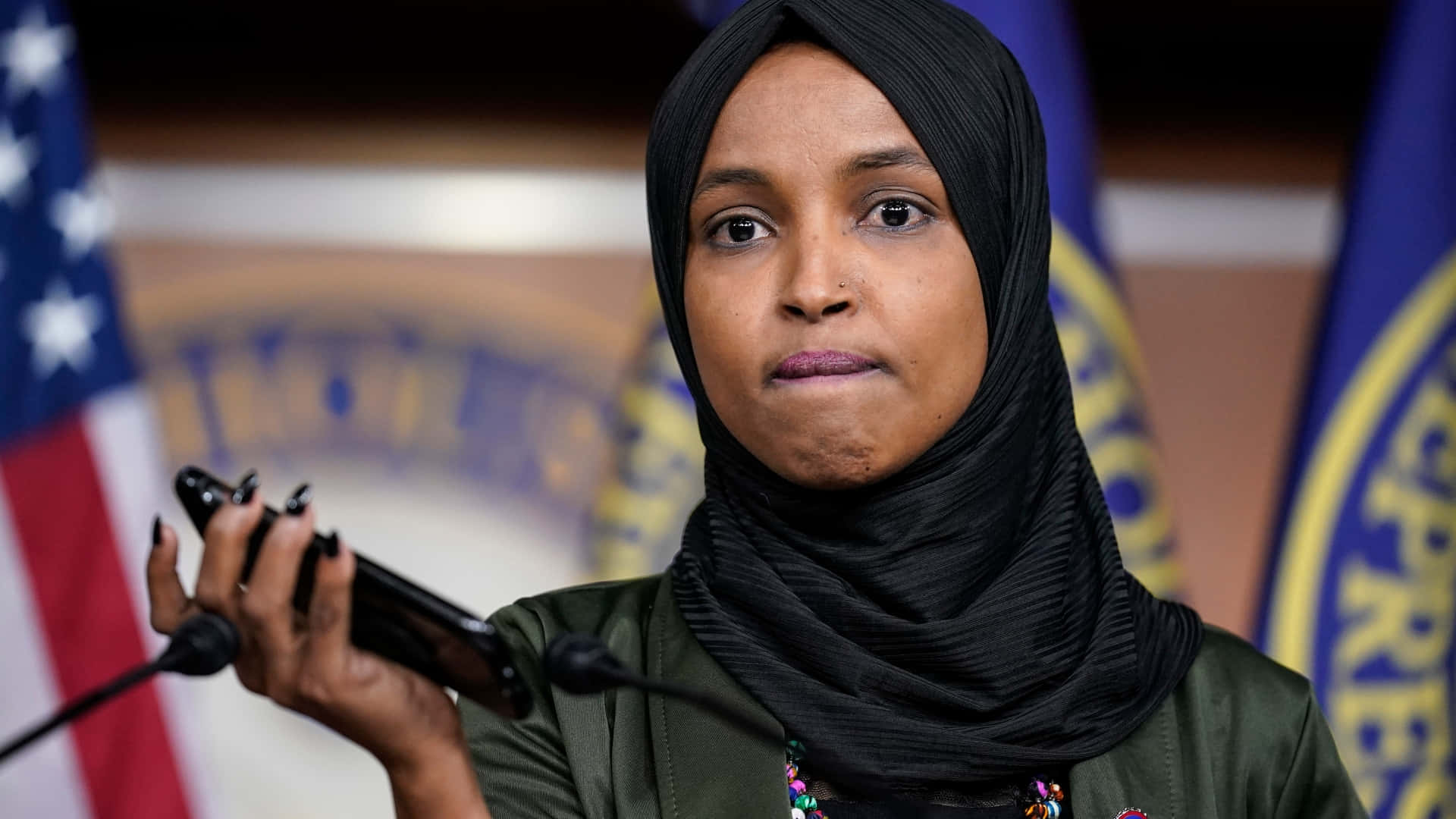 Ilhan Omar Biting Her Lower Lip Background