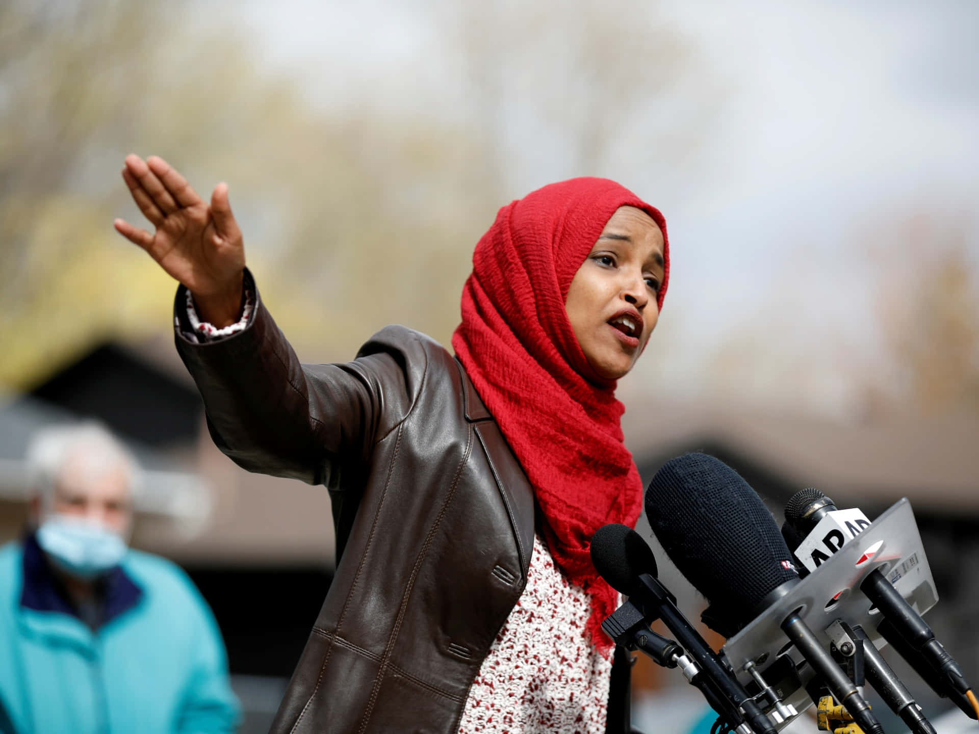 Ilhan Omar Explaining To The Public Background
