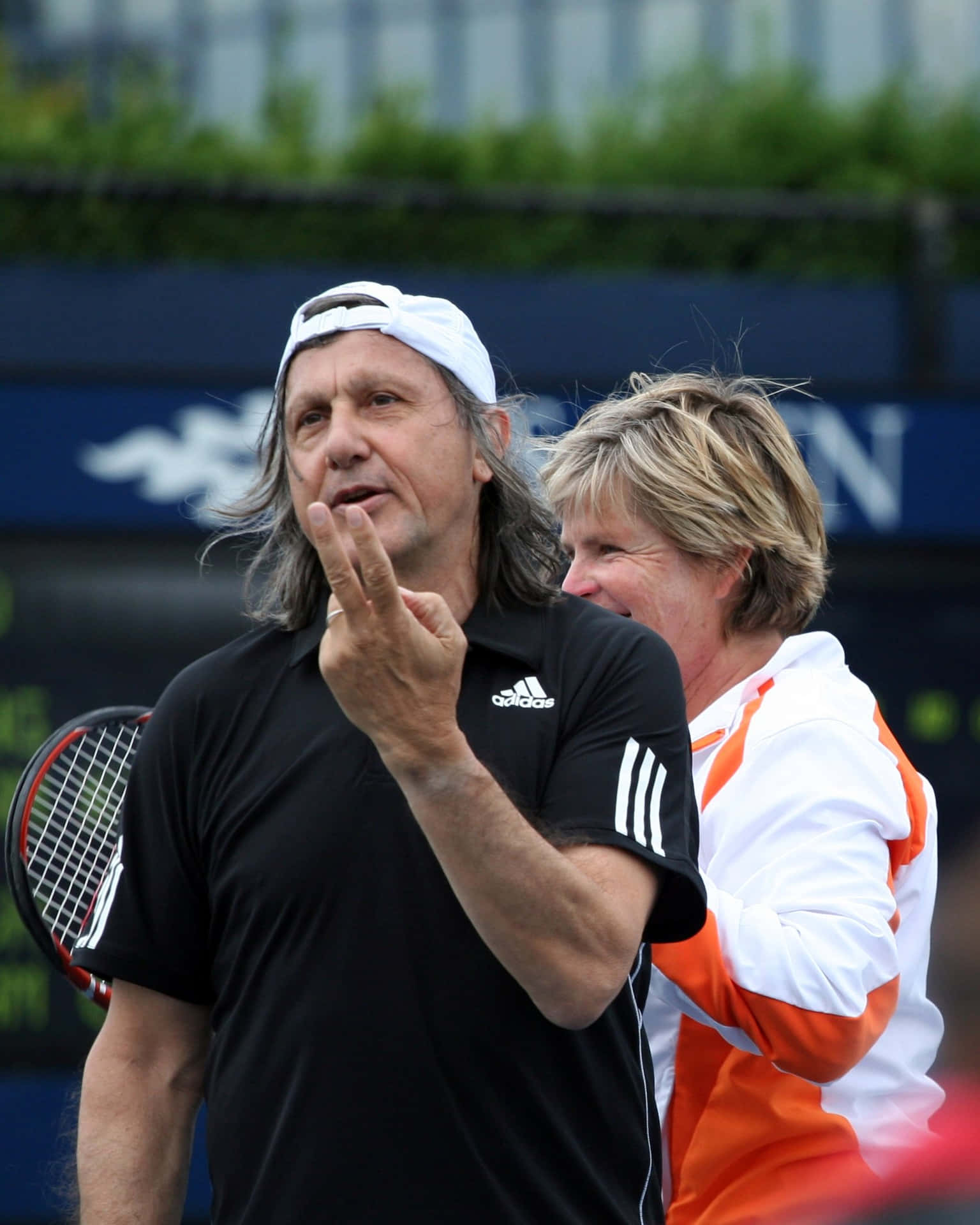 Ilie Năstase In Action During Us Open Exhibition Game Background
