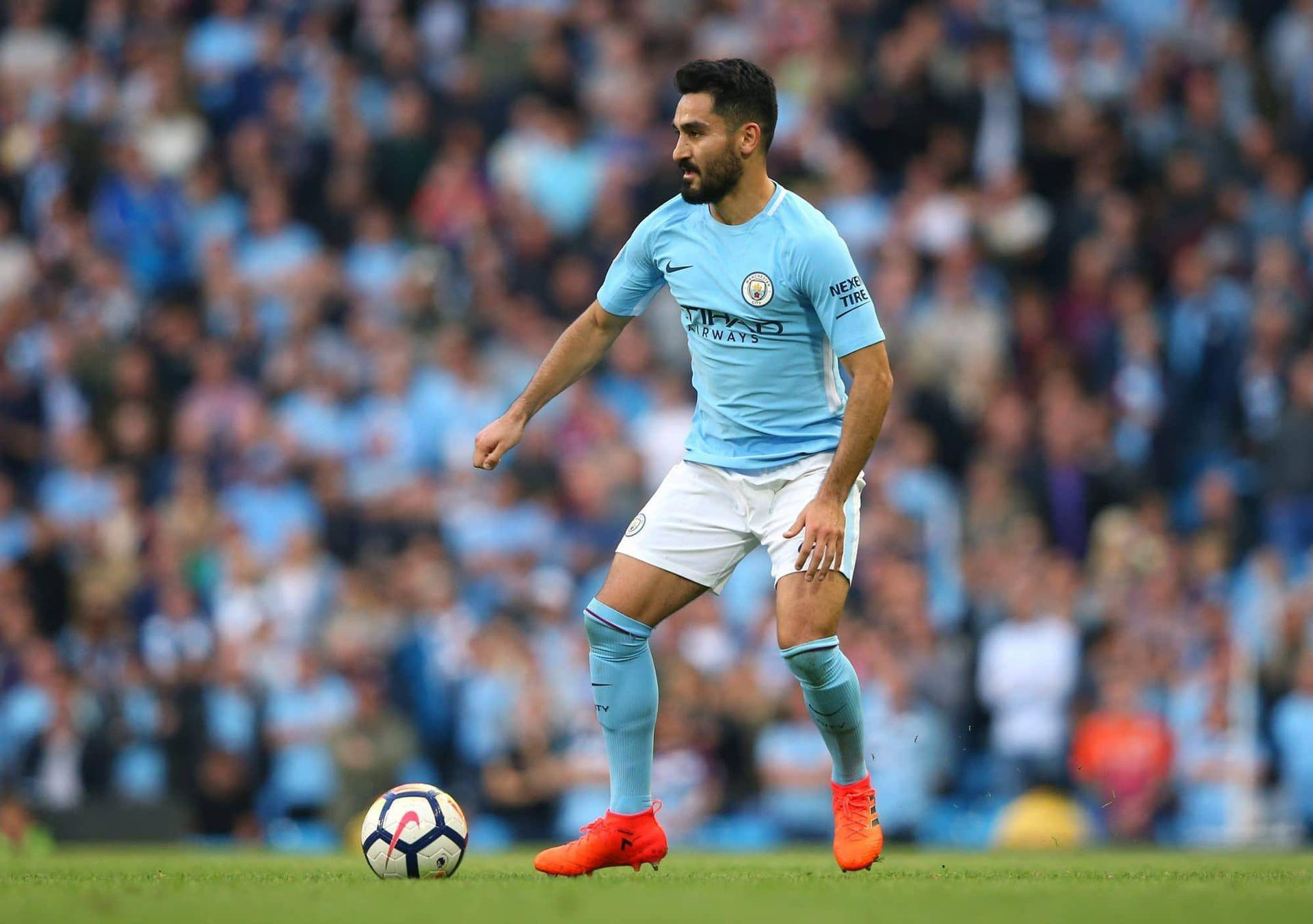 Ilkay Gundogan Kicking Ball To Side Background