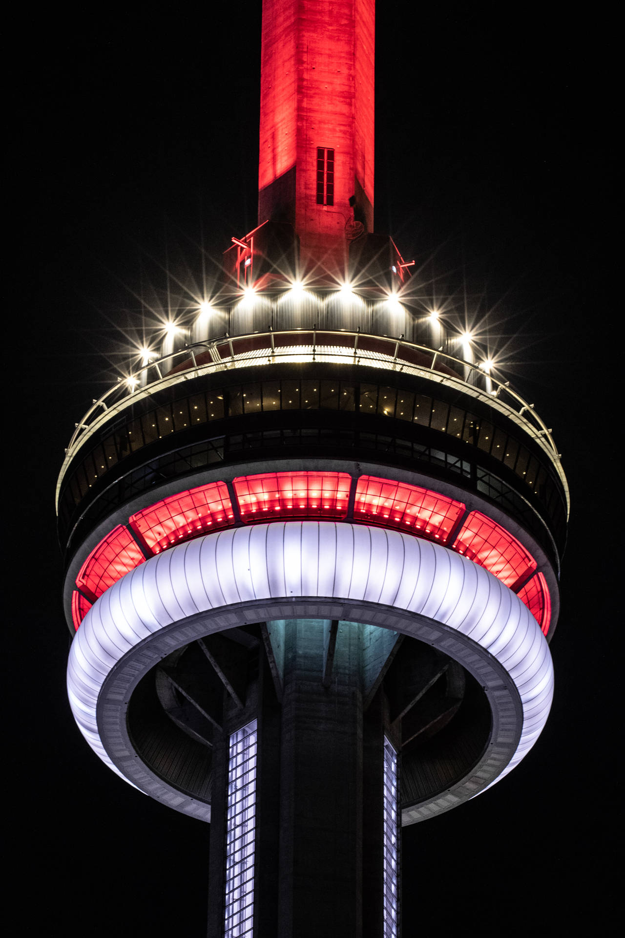 Illuminated Cn Tower Dominating Skyline At Night