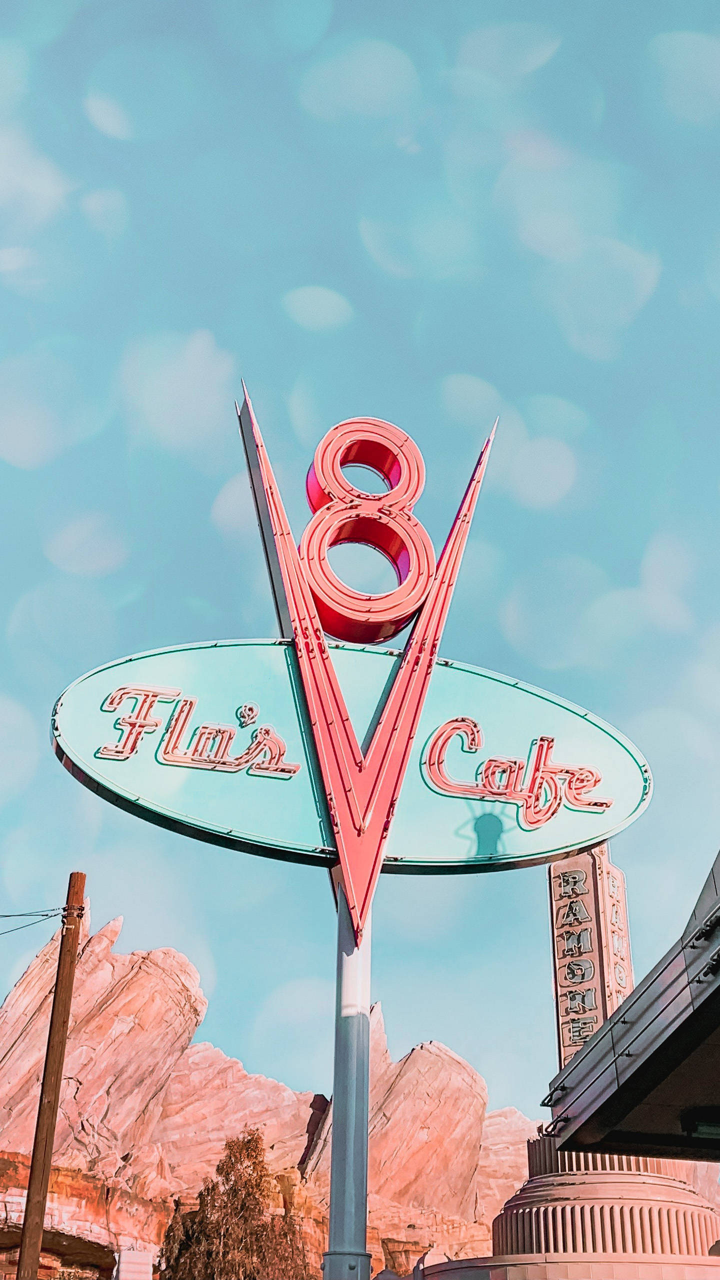 Illuminated Flo's V8 Cafe Sign At Disneyland Background