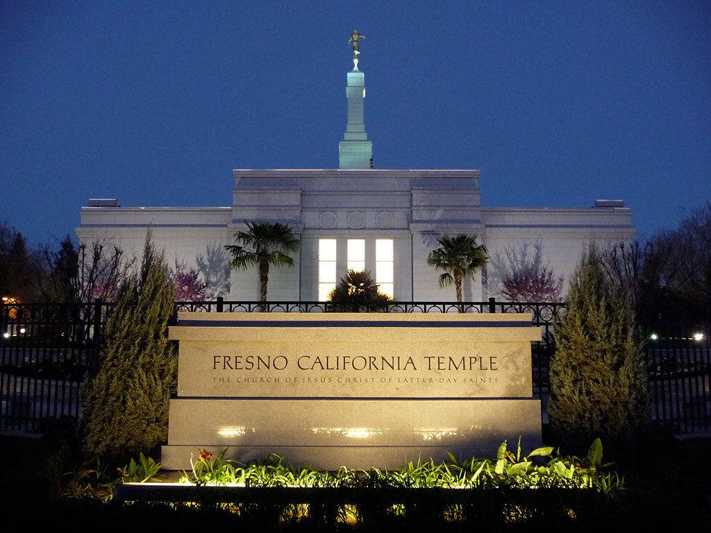 Illuminated Fresno California Temple At Night Background