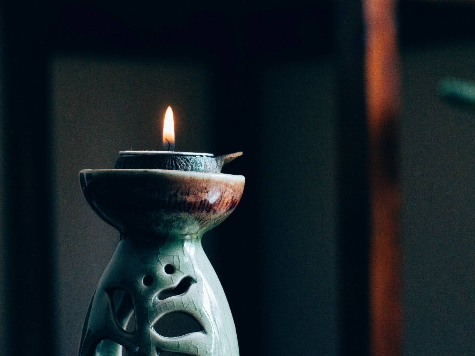 Illuminated Holistic Porcelain Candle Background