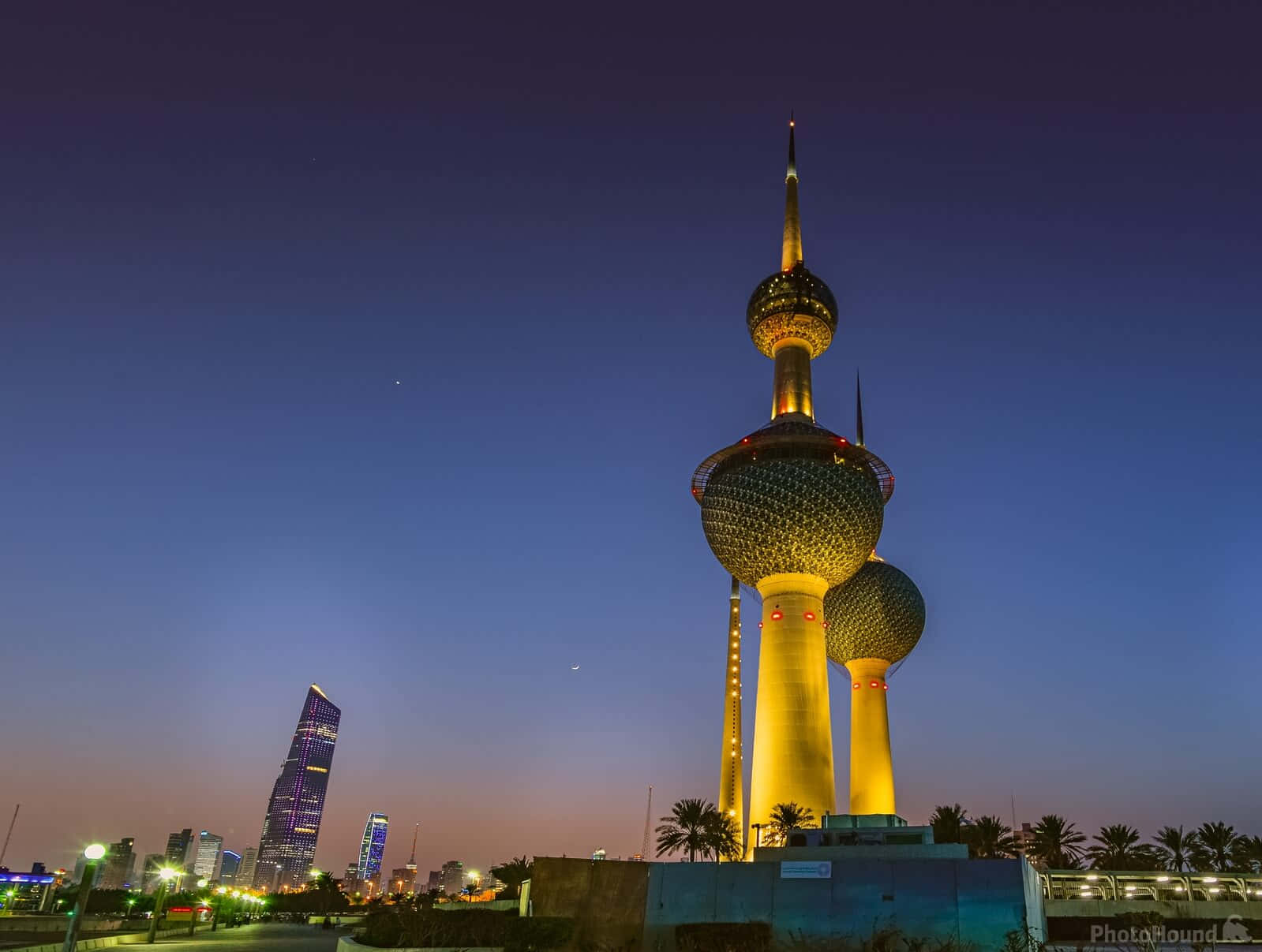 Illuminated Kuwait Towers At Night Background