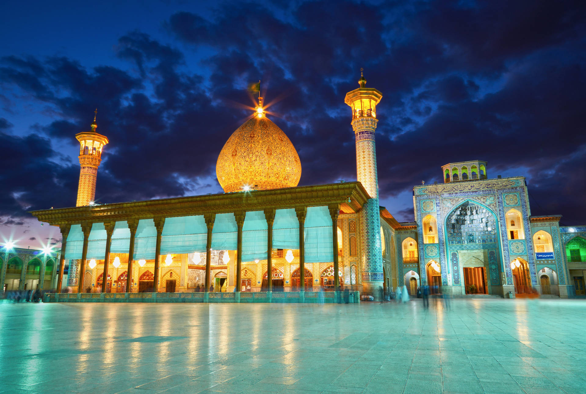 Illuminated Mosque Against Night Sky In Iran Background