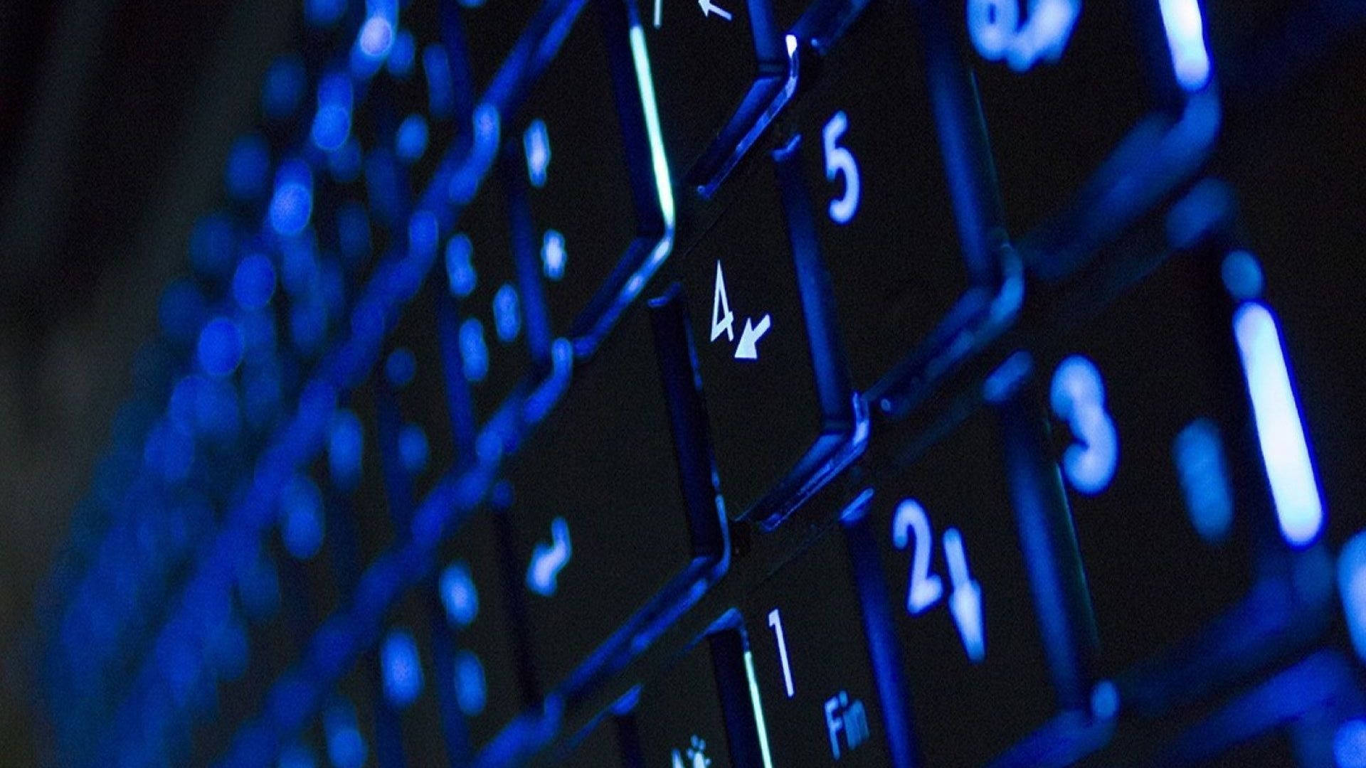 Illuminated Neon Blue Keyboard Background