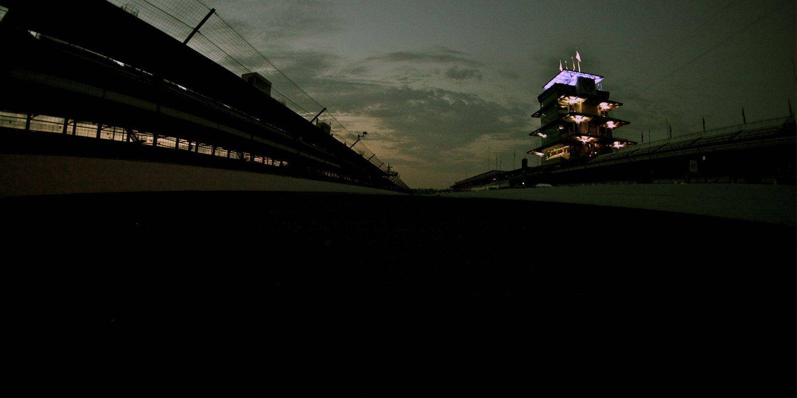 Illuminated Night At The Indianapolis 500 Motor Speedway Background