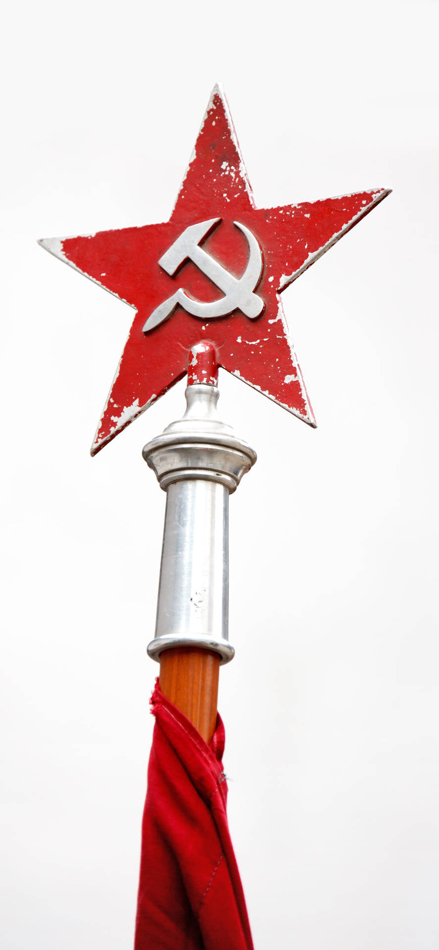 Illuminated Red Star On Tower Signage At Night Background