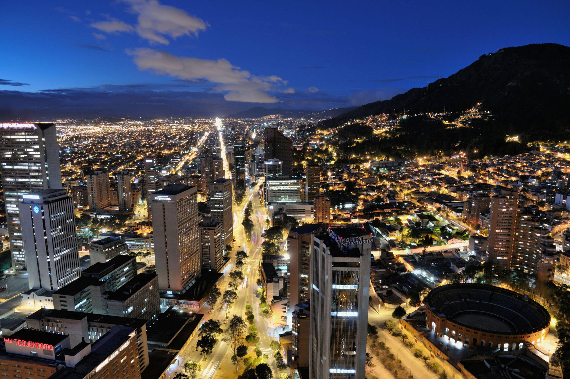 Illuminated Roads Of Bogota At Night Background