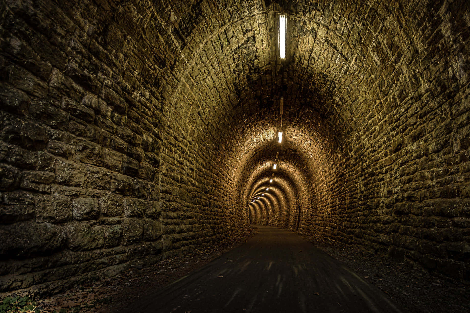 Illuminated Stone Tunnel Pathway