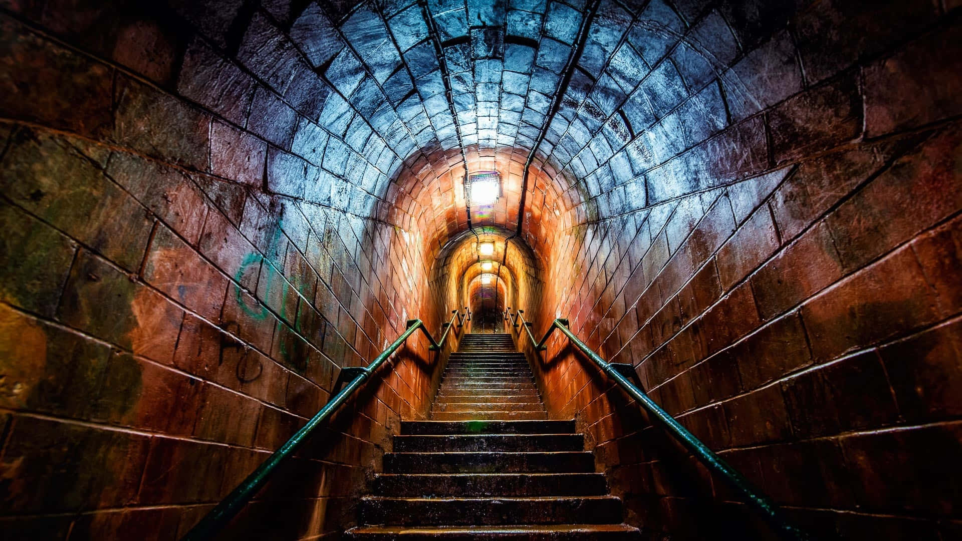 Illuminated Stone Tunnel Staircase Background