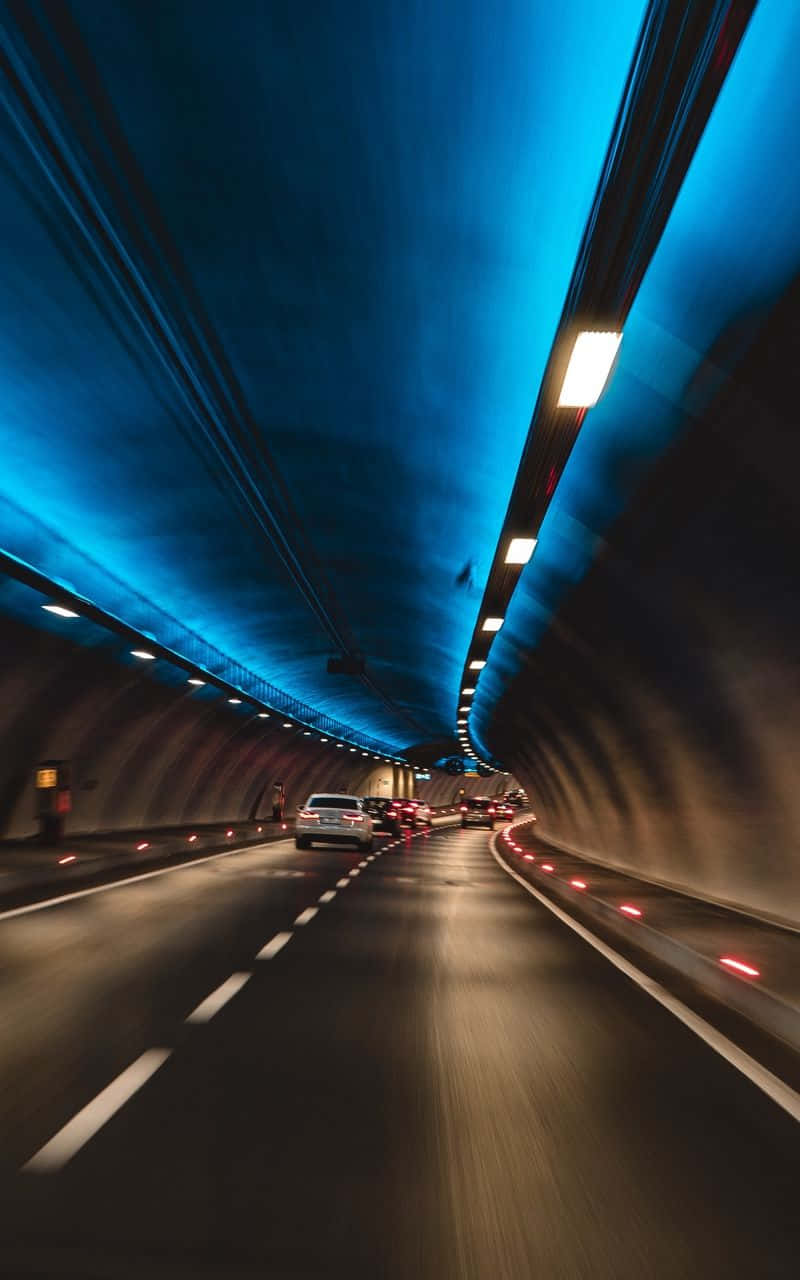 Illuminated Tunnel Traffic Flow Background