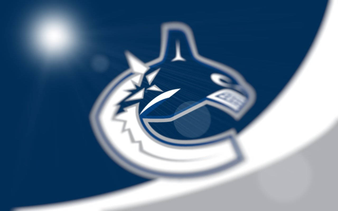 Illuminated Vancouver Canucks Logo Background