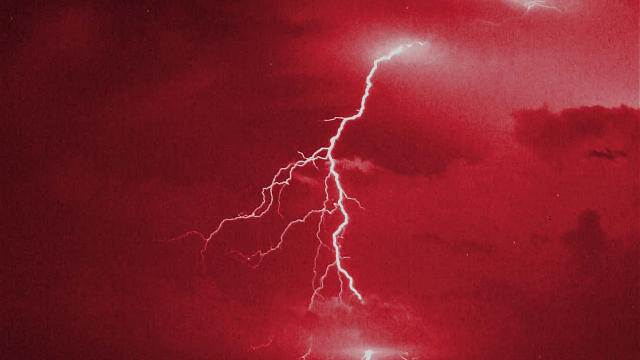 Illuminating The Night Sky With Red Lightning Background