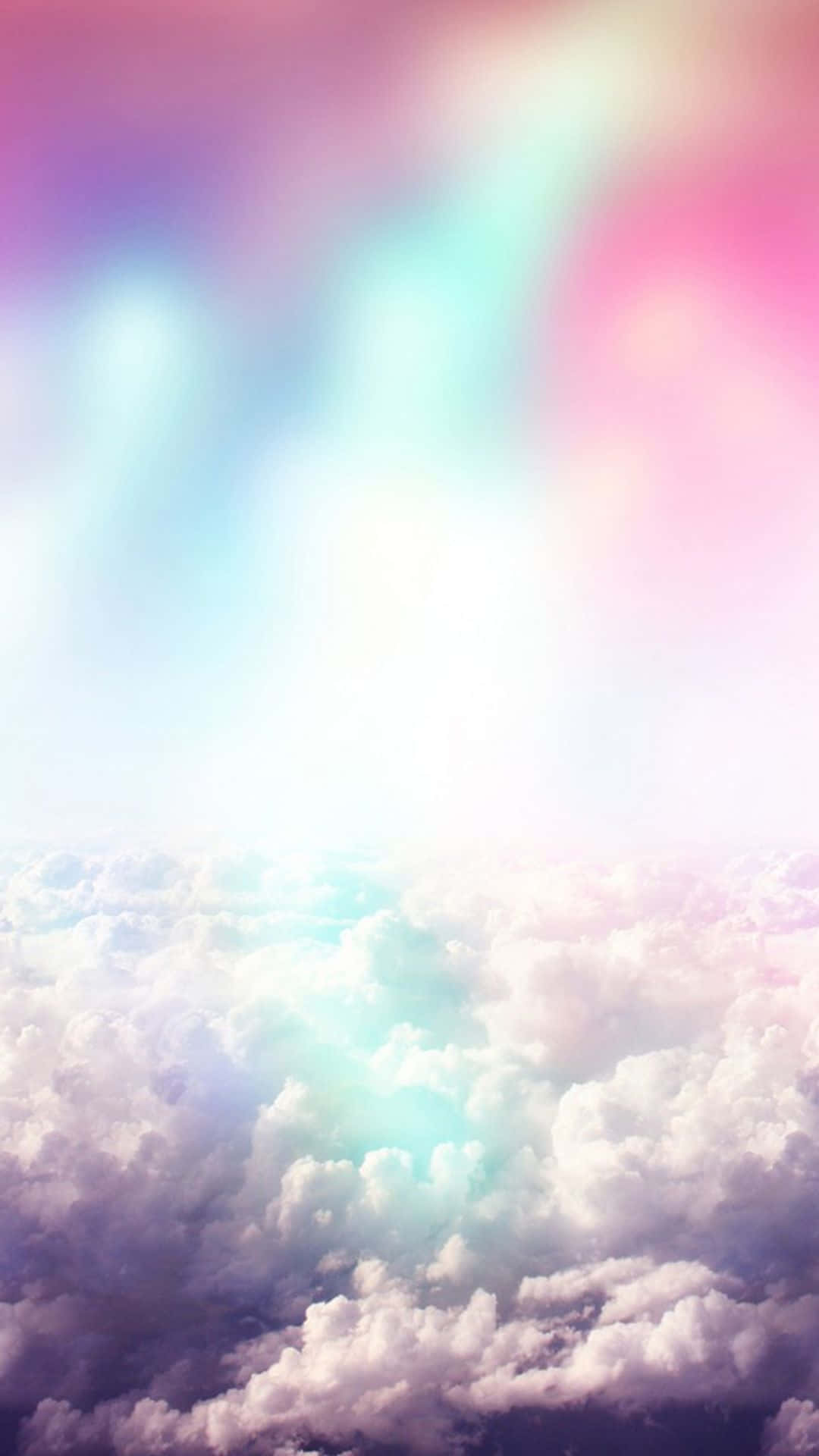 Image A Cheerful Rainbow Against A Sky Of Soft Clouds. Background