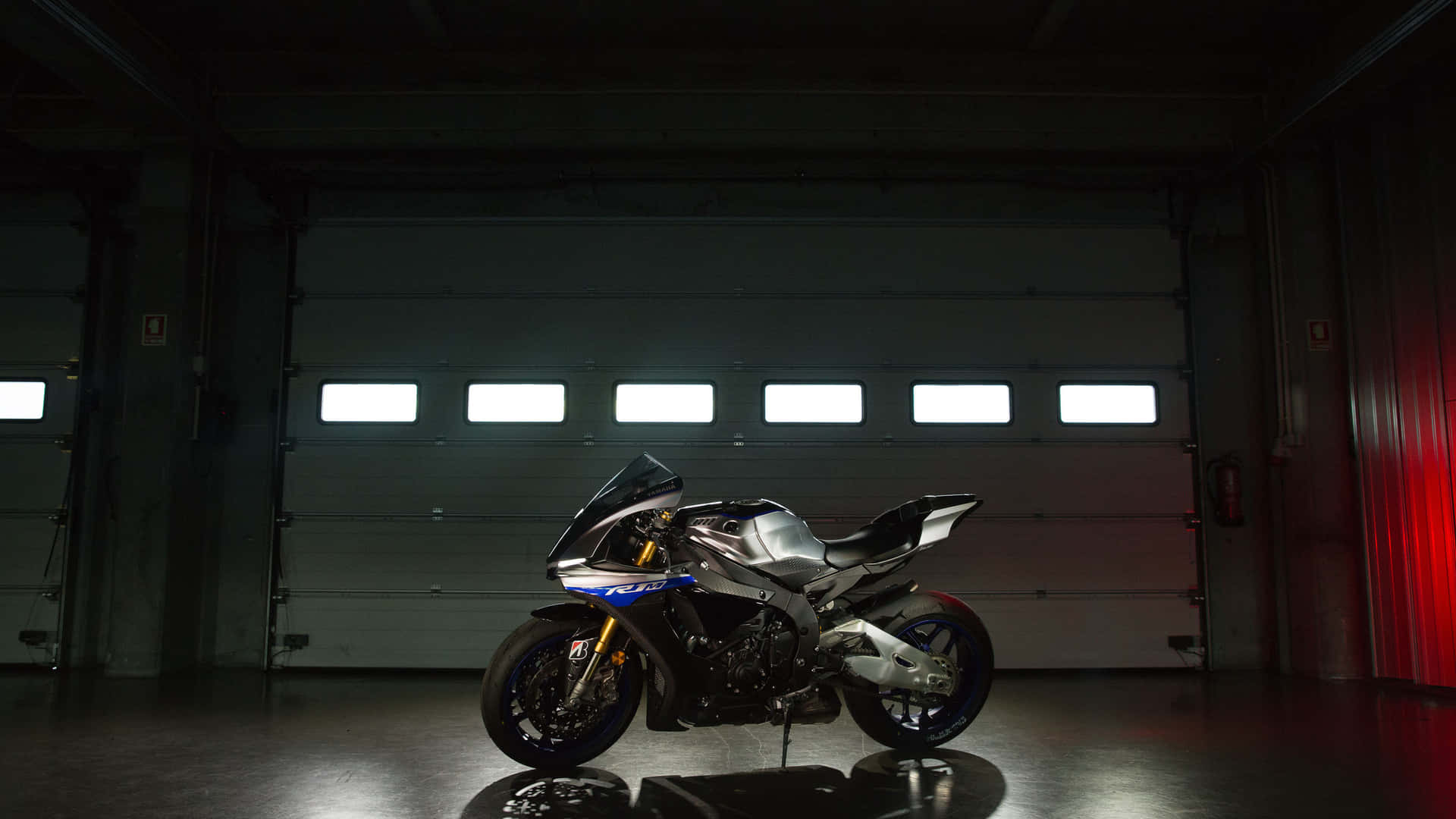 Image A Motorcycle Riding High On The Road Background