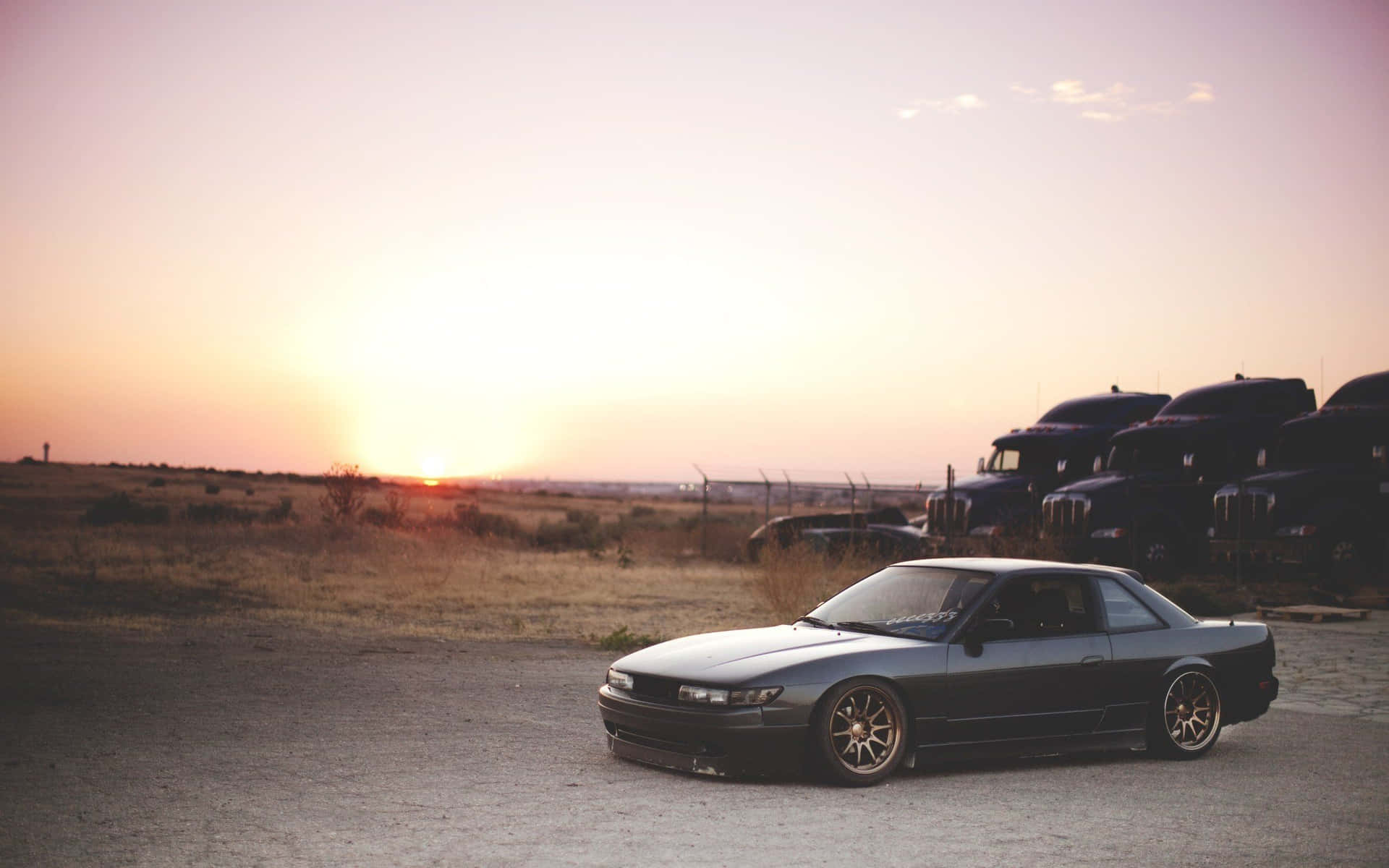 Image A Nissan Silvia S13 Sitting In A Car Park Background