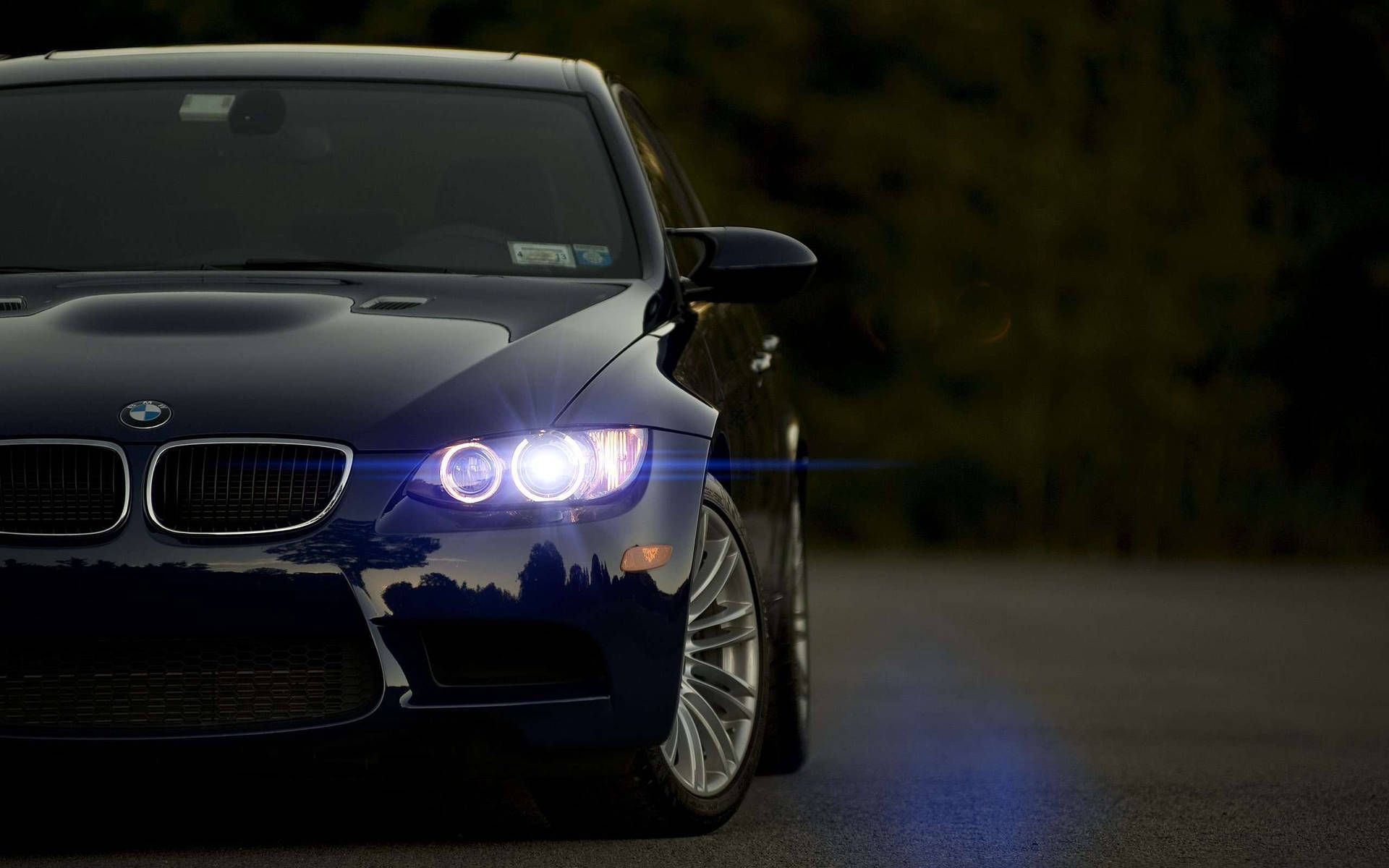 Image A Sleek Black Bmw Car Against A High-definition City Skyline. Background