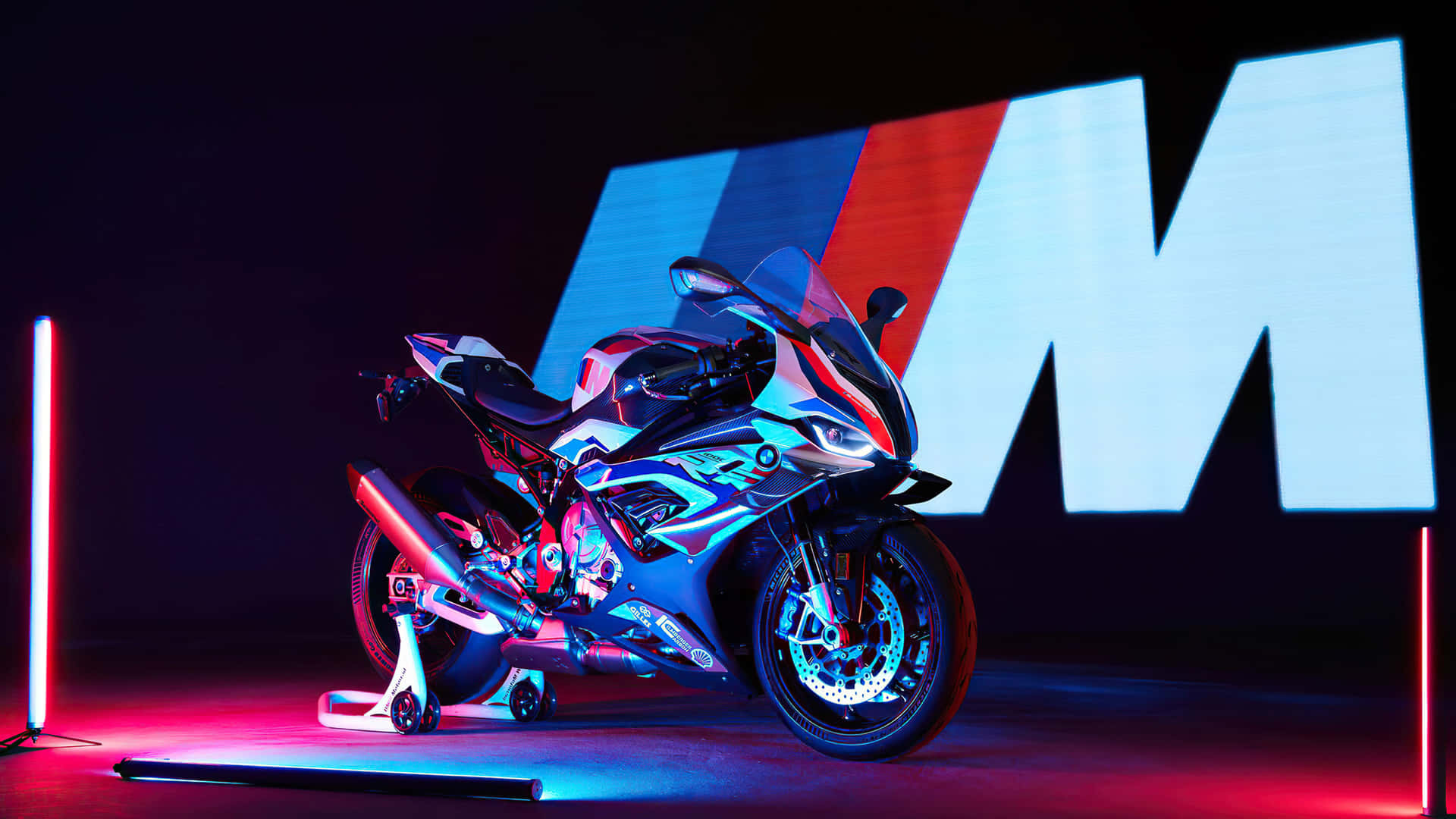 Image A Sleek Motorcycle Parked On The Side Of An Open Road. Background