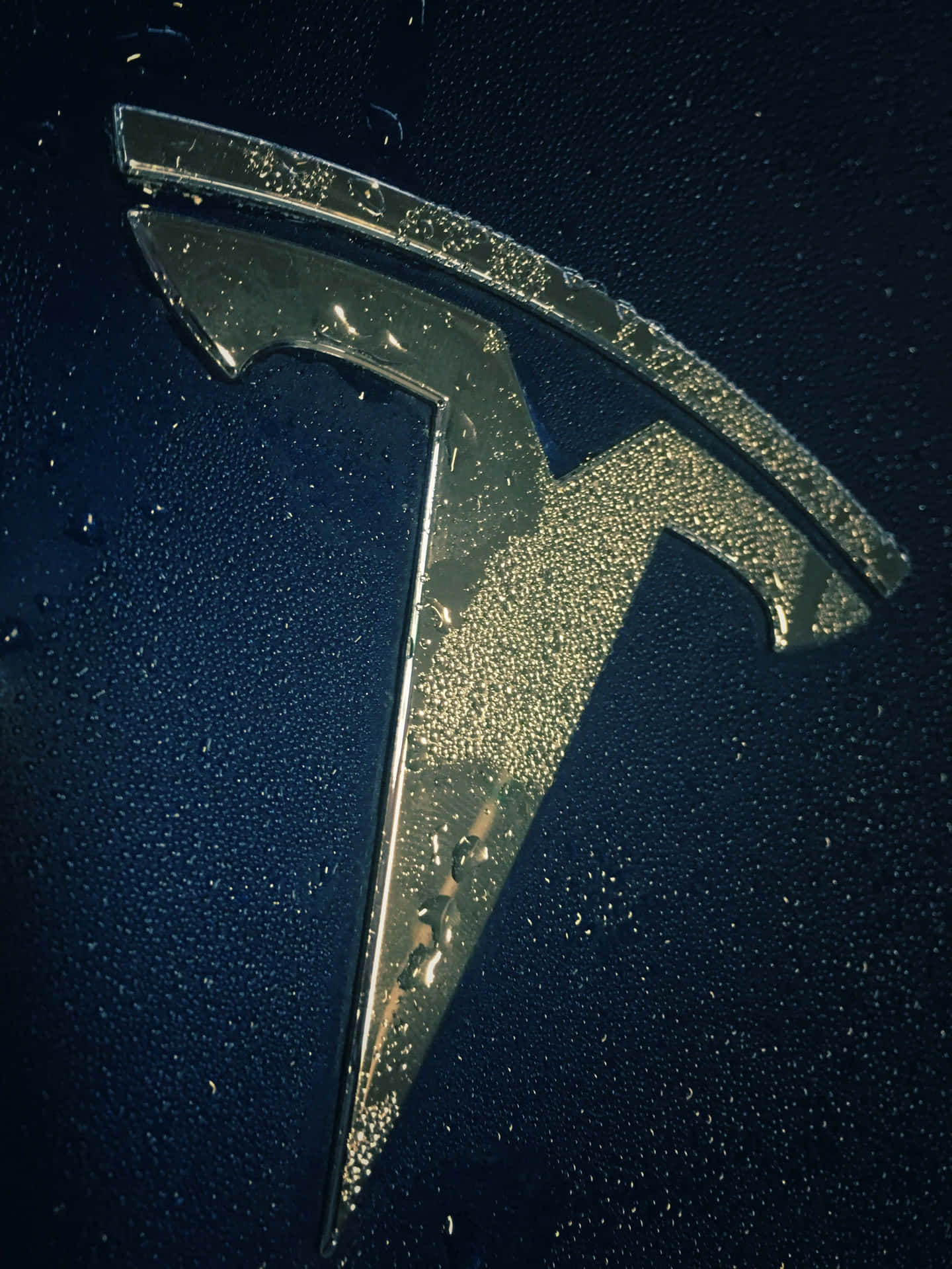 Image A Sleek Tesla Logo With Illuminated Lightning Bolts In 4k Resolution Background
