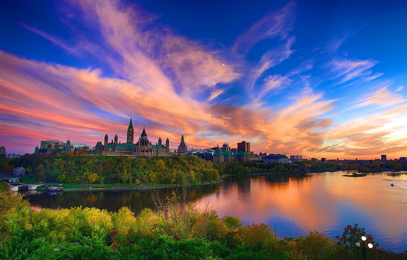 Image Canadian Parliament Buildings In The Blue And Orange Skies Background